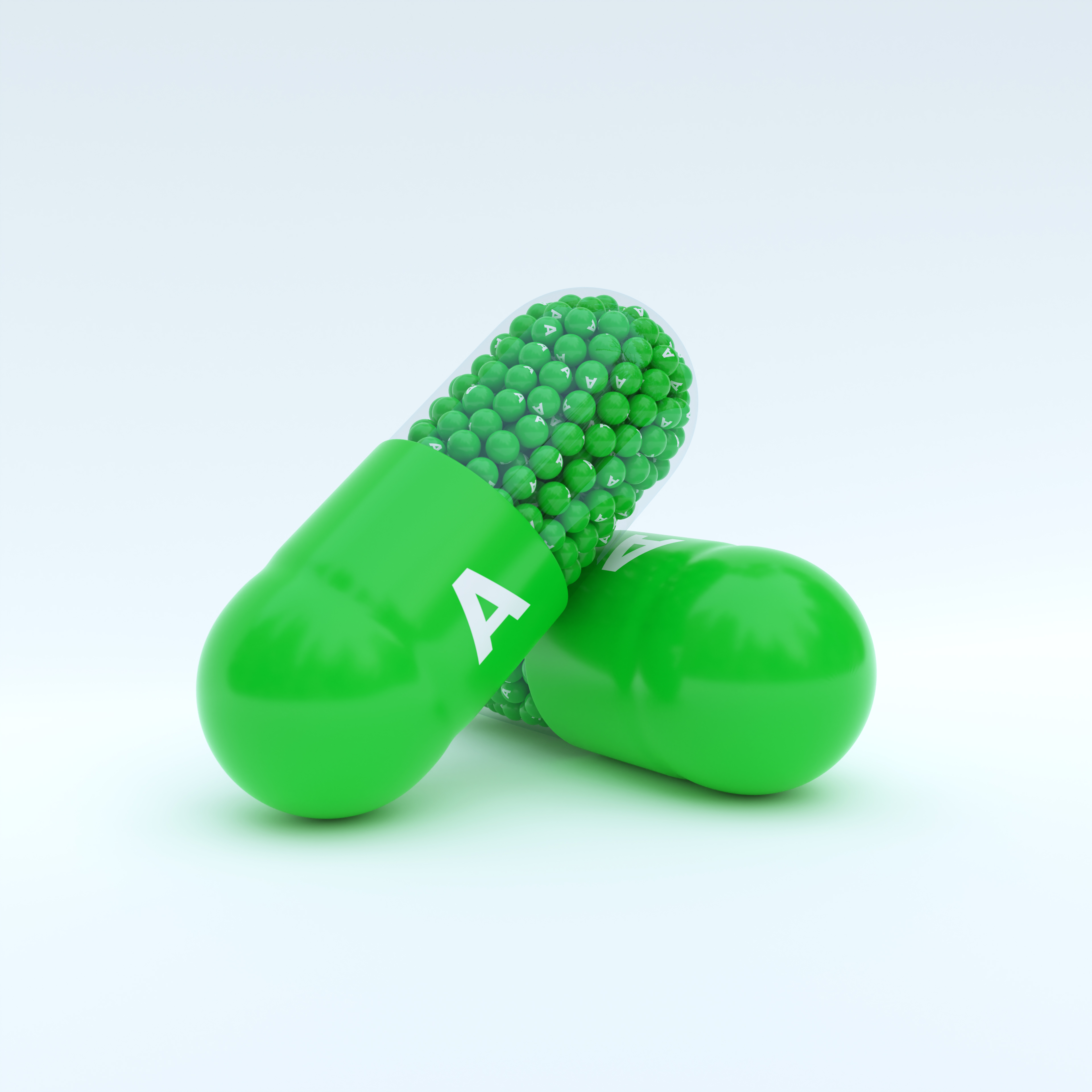 Vitamin A With Green Capsule, Granules and White Background