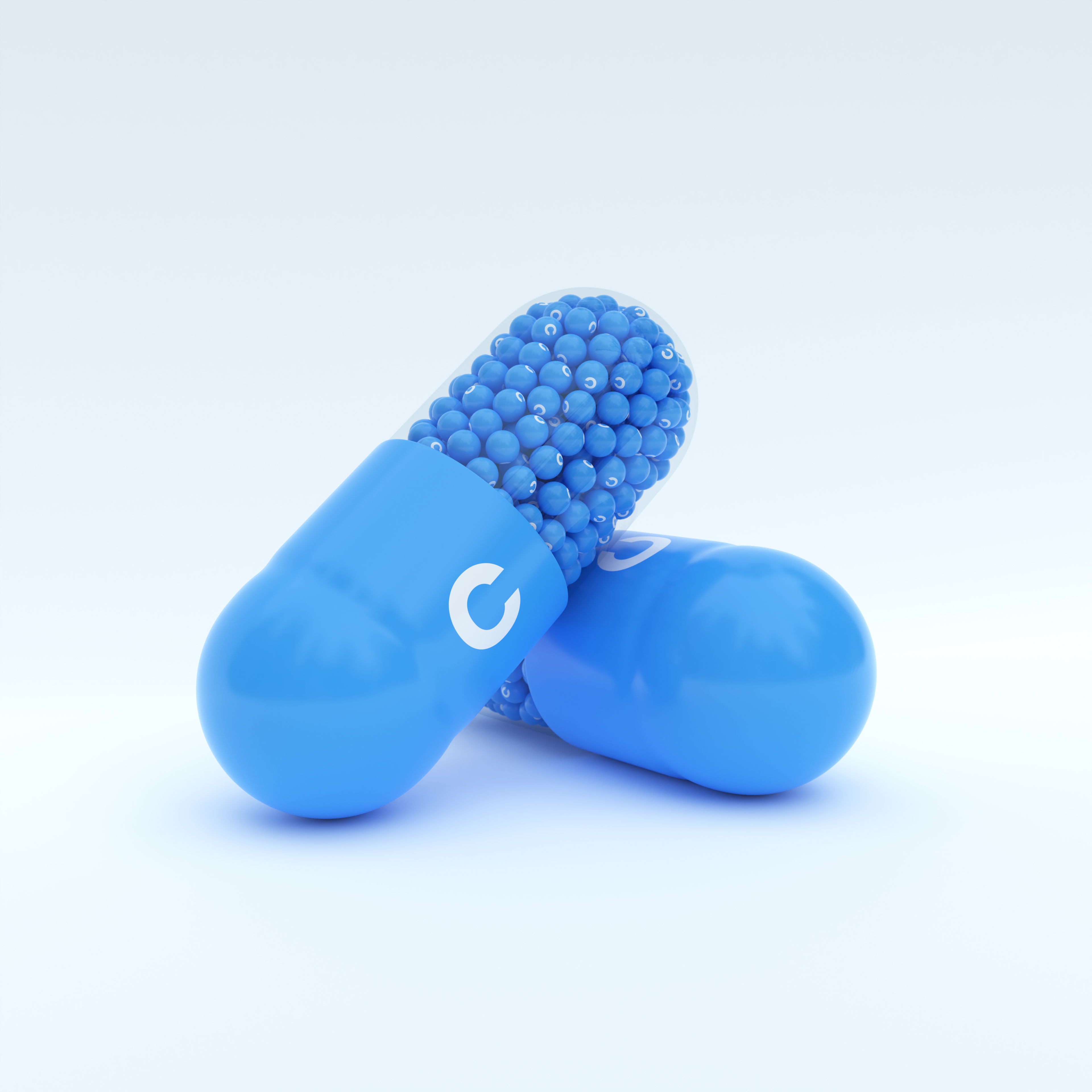 Vitamin C With Blue Capsule, Granules and White Background