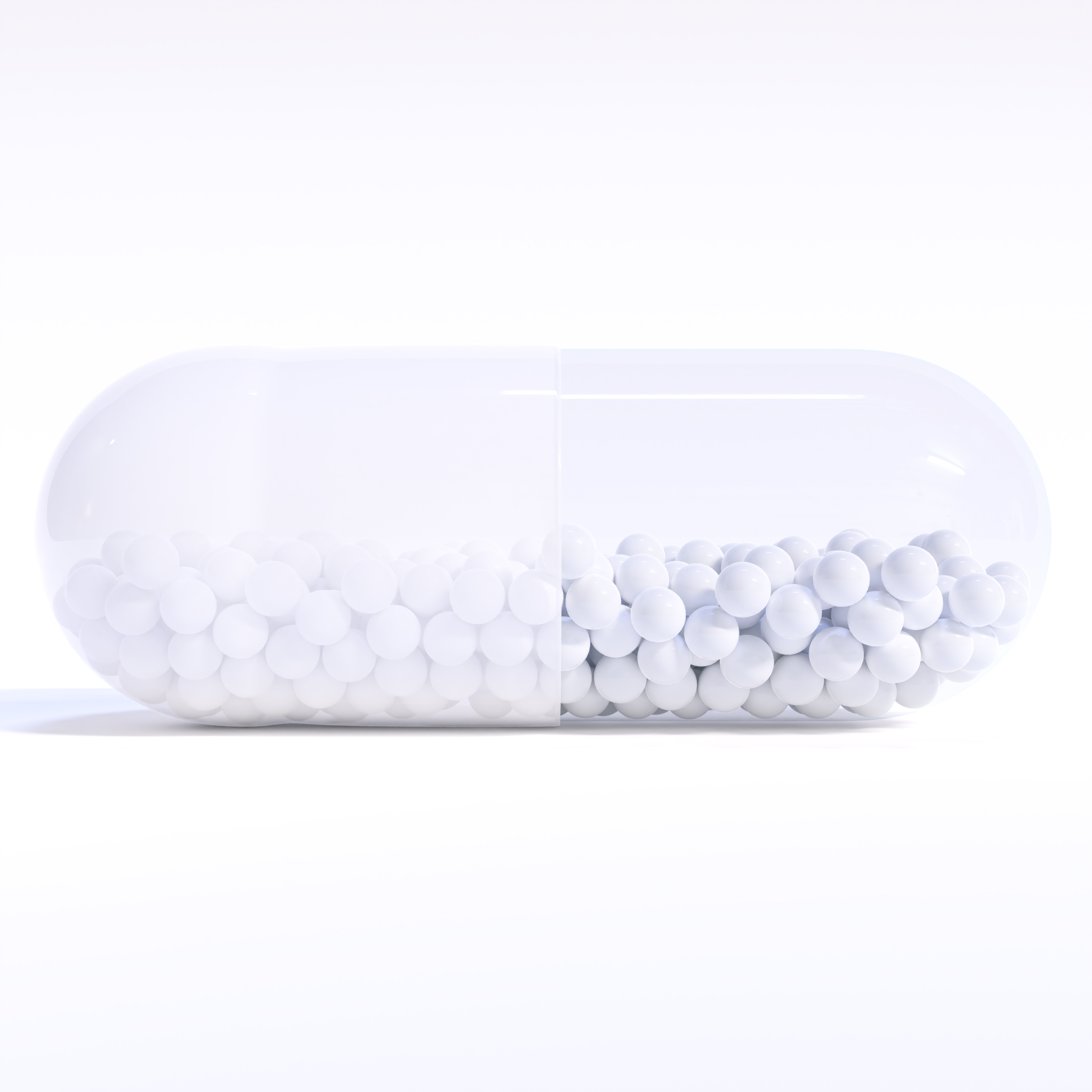 Transparent White Capsule With Granules With White Background