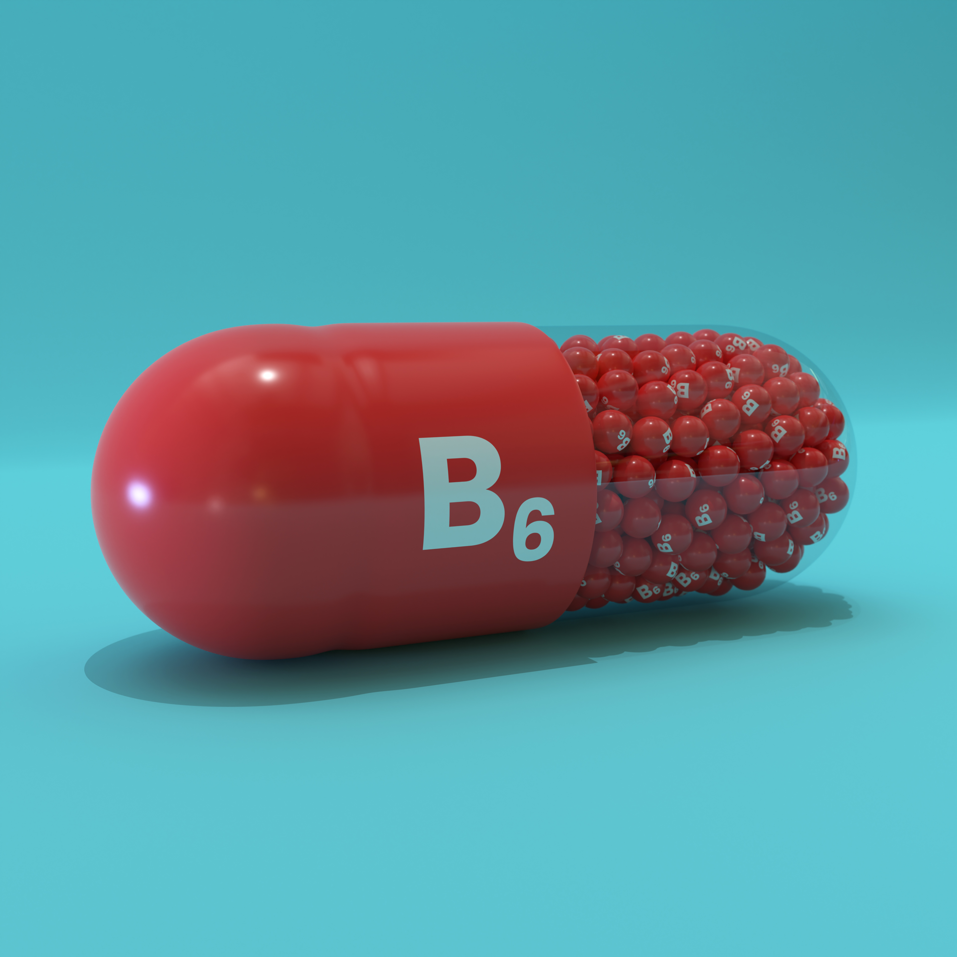 Vitamin B6 With Red Capsule, Granules and Turqoise Background