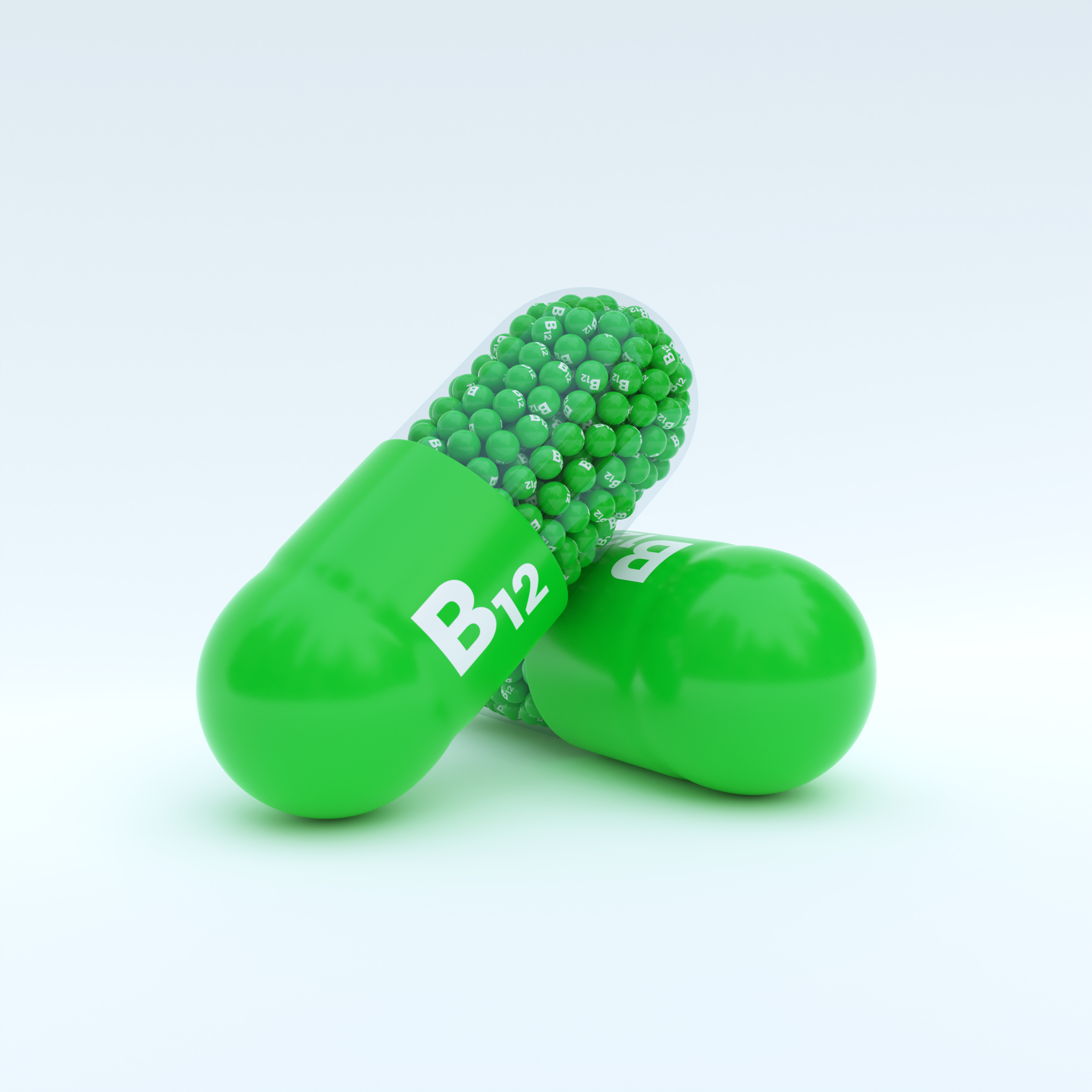 Vitamin B12 With Green Capsule, Granules and White Background