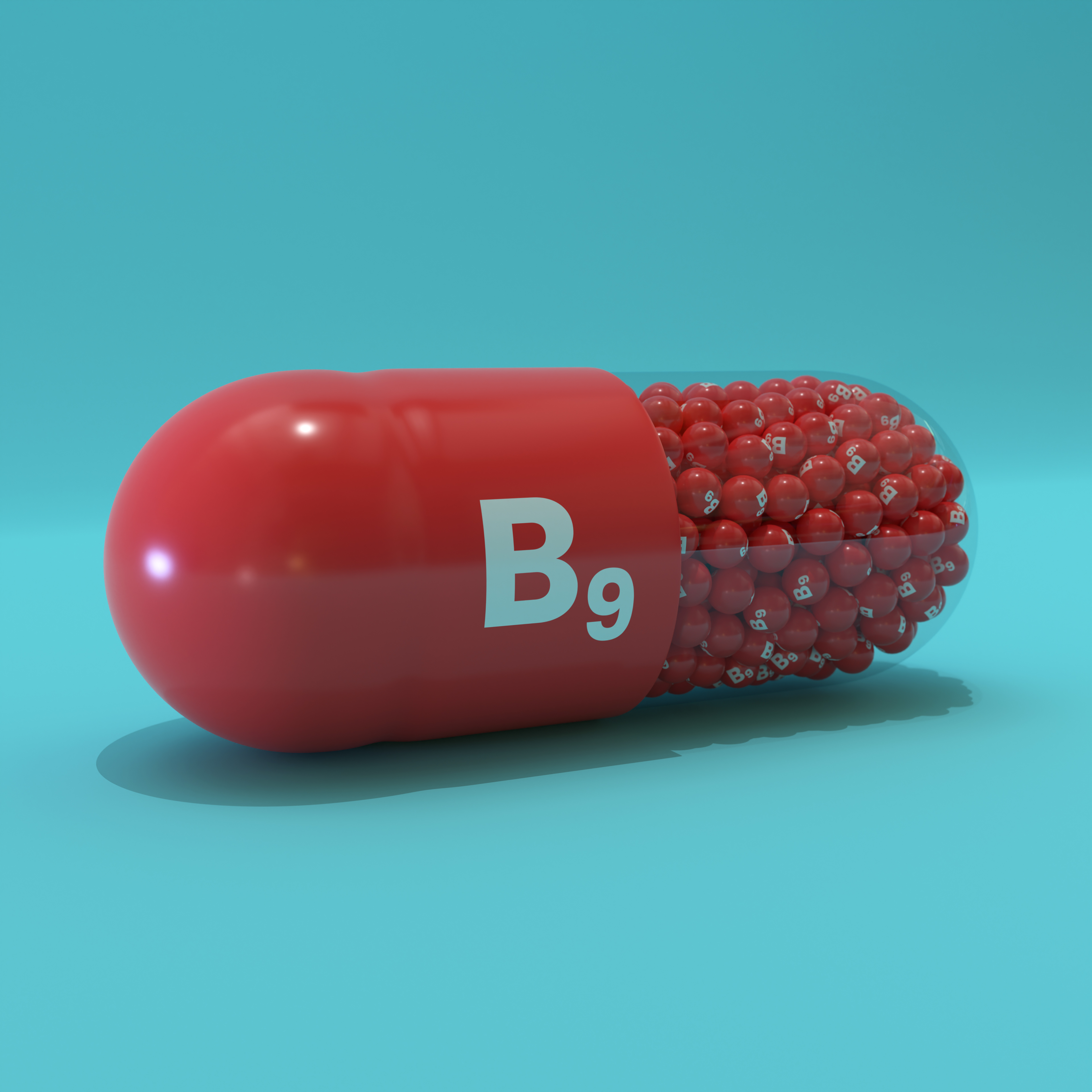 Vitamin B9 With Red Capsule, Granules and Turqoise Background