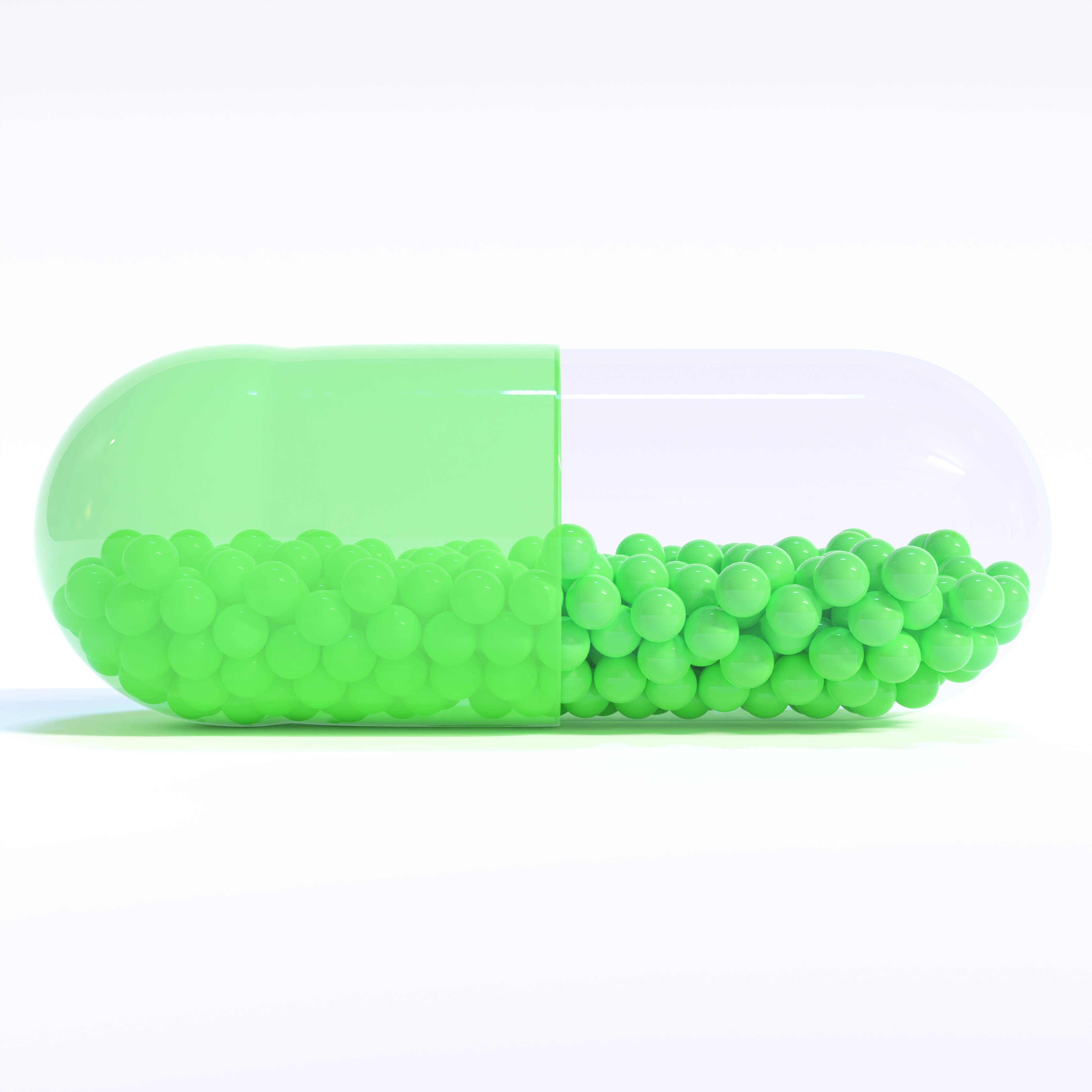 Transparent Green Capsule With Granules With White Background