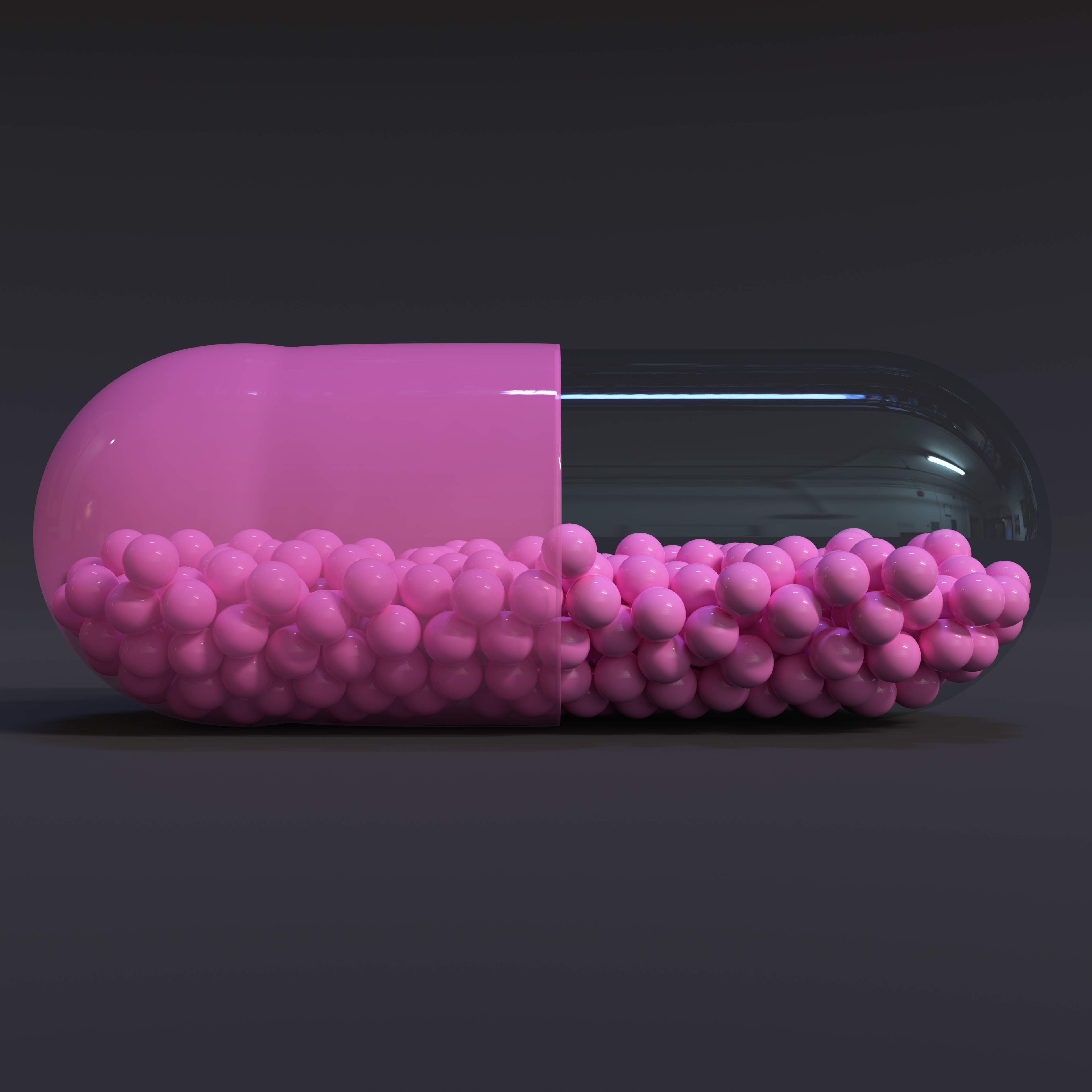Transparent Pink Capsule With Granules With Dark Background