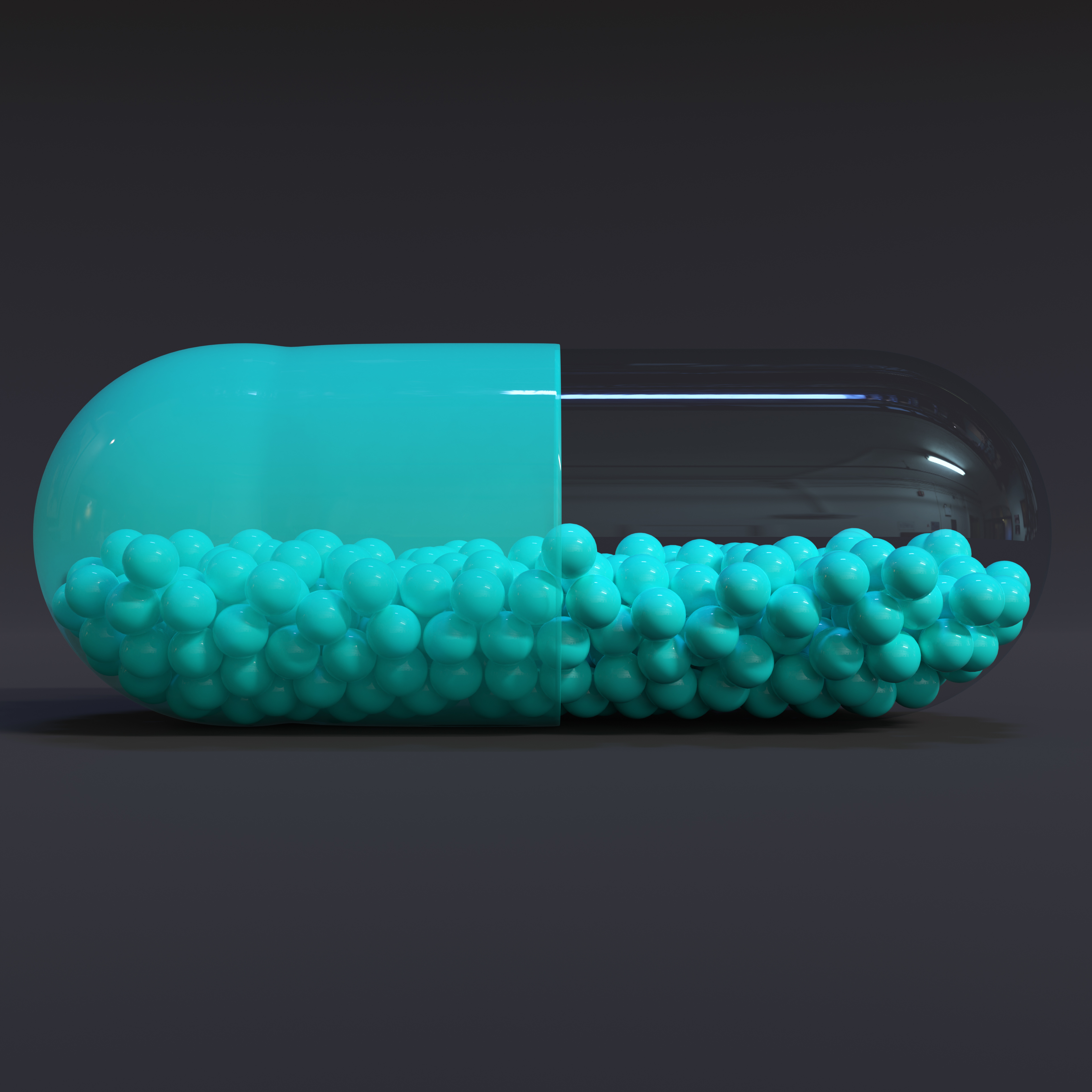 Transparent Turqoise Capsule With Granules With Dark Background