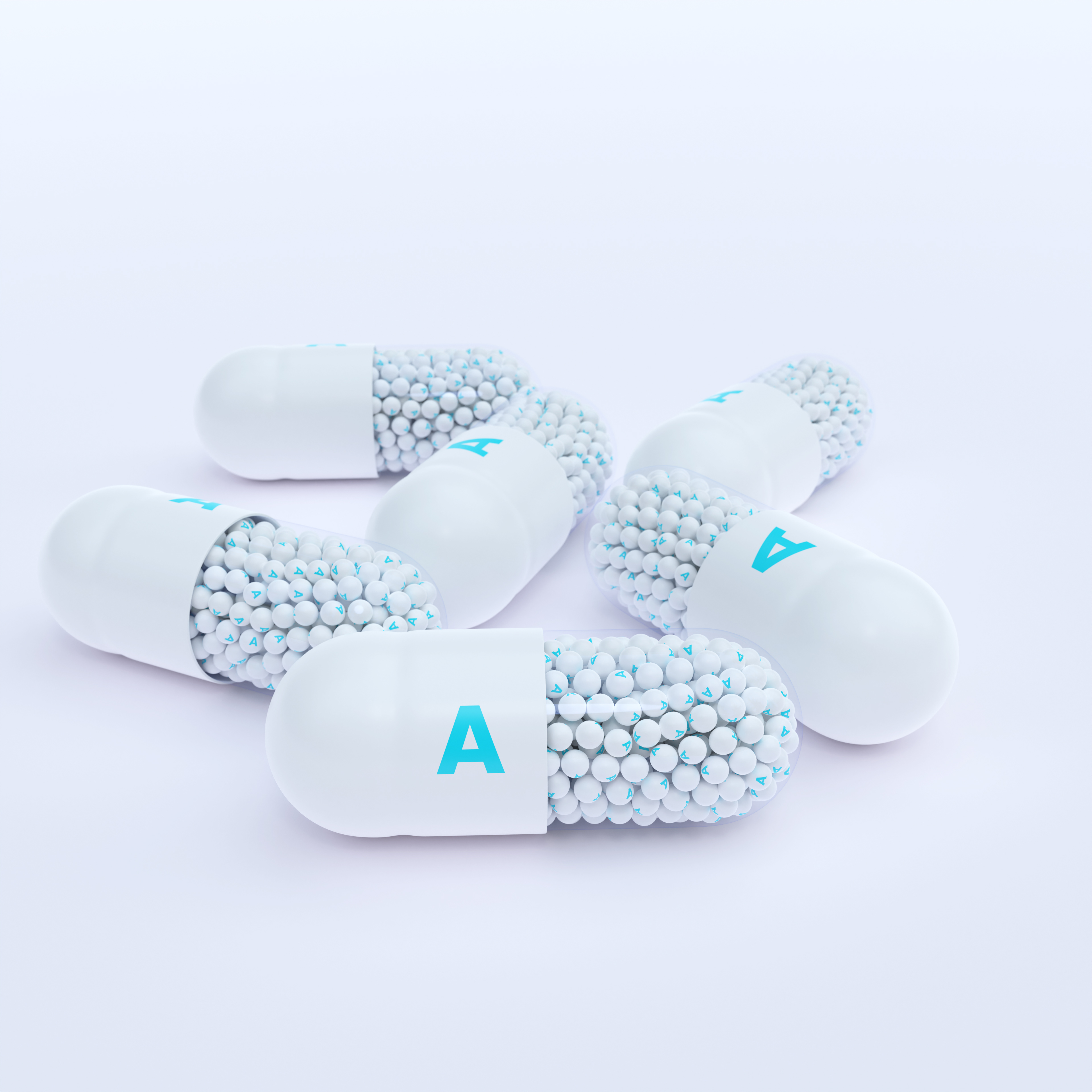 Vitamin A With White Capsules, Granules and White Background