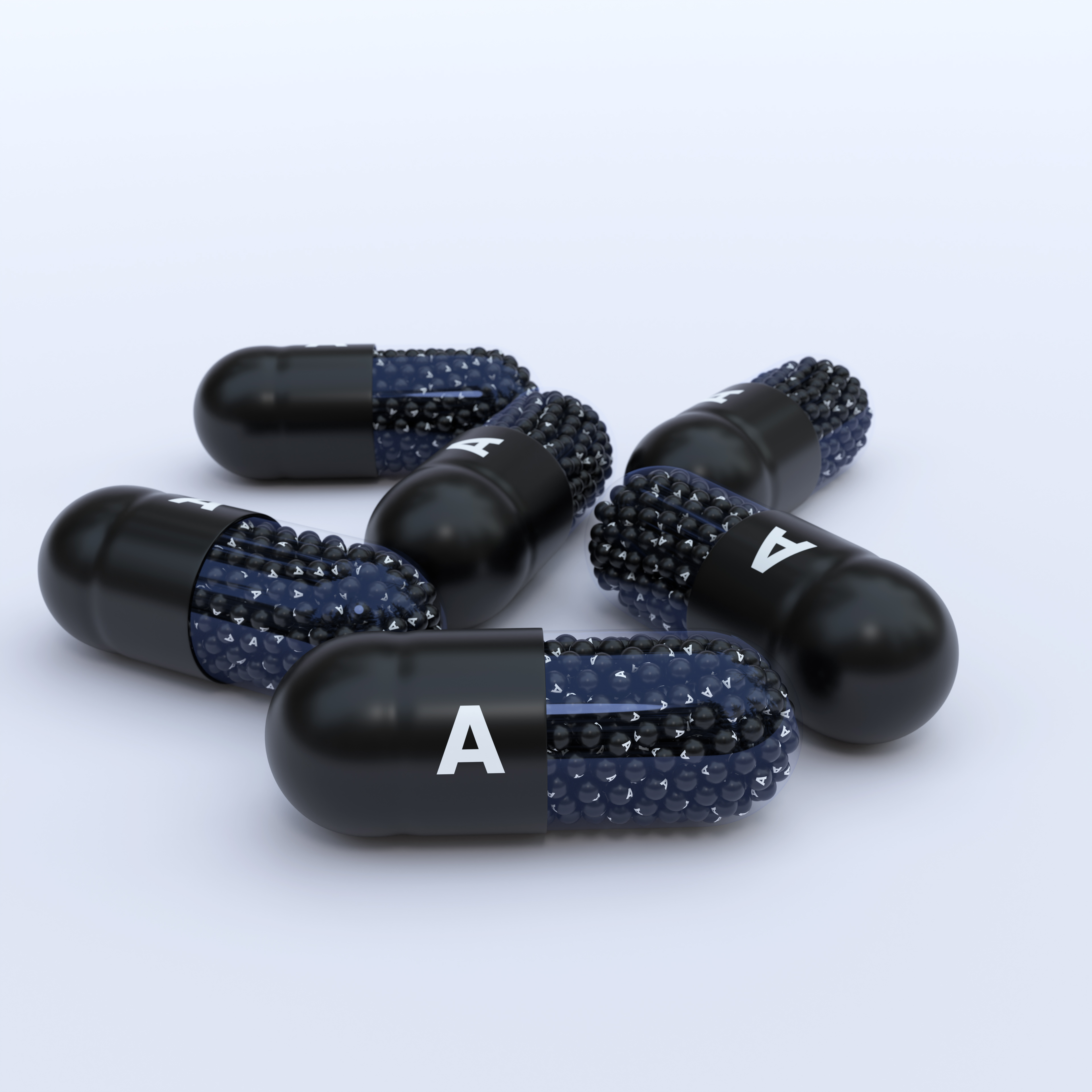 Vitamin A With Black Capsules, Granules and White Background