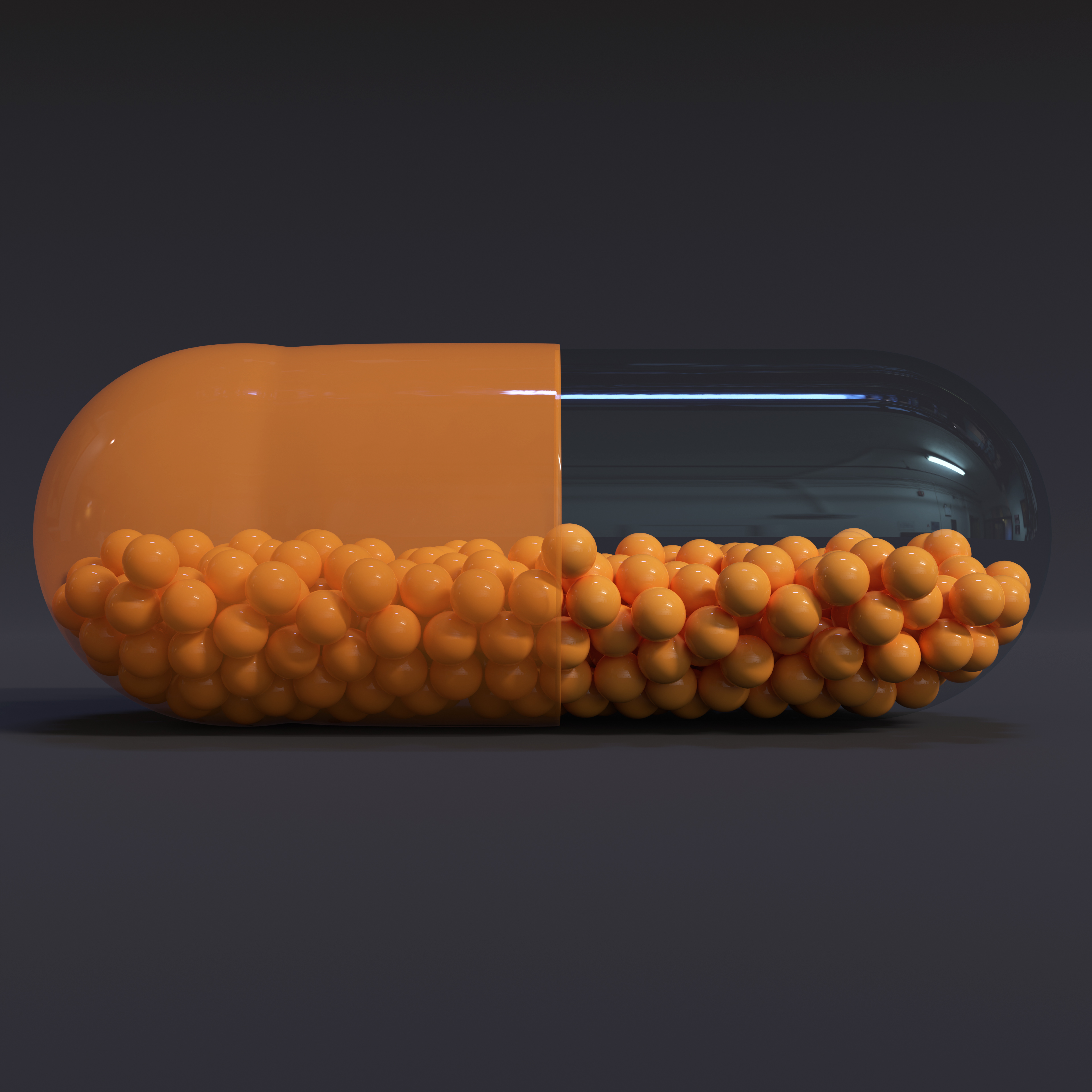 Transparent Orange Capsule With Granules With Dark Background