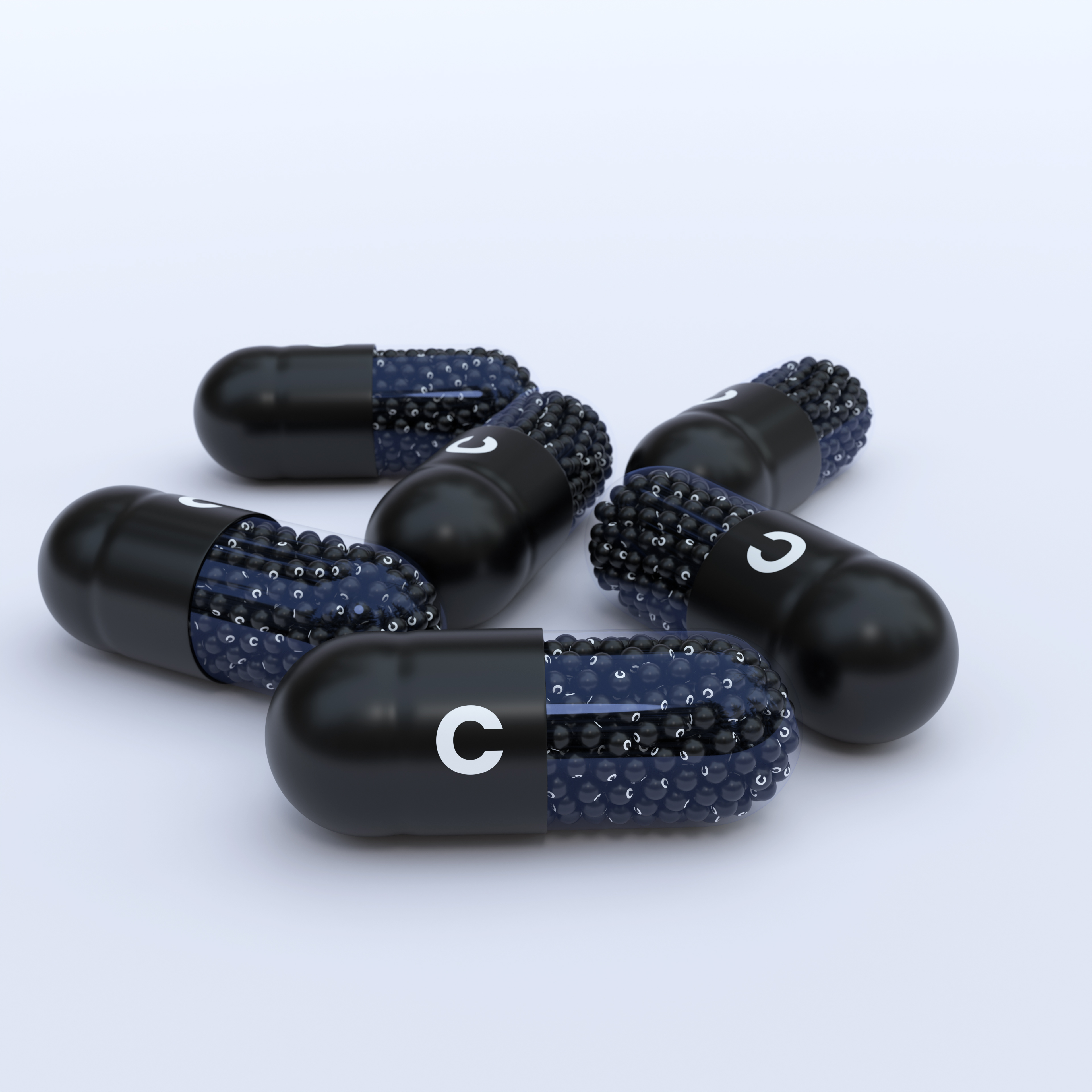 Vitamin C With Black Capsules, Granules and White Background