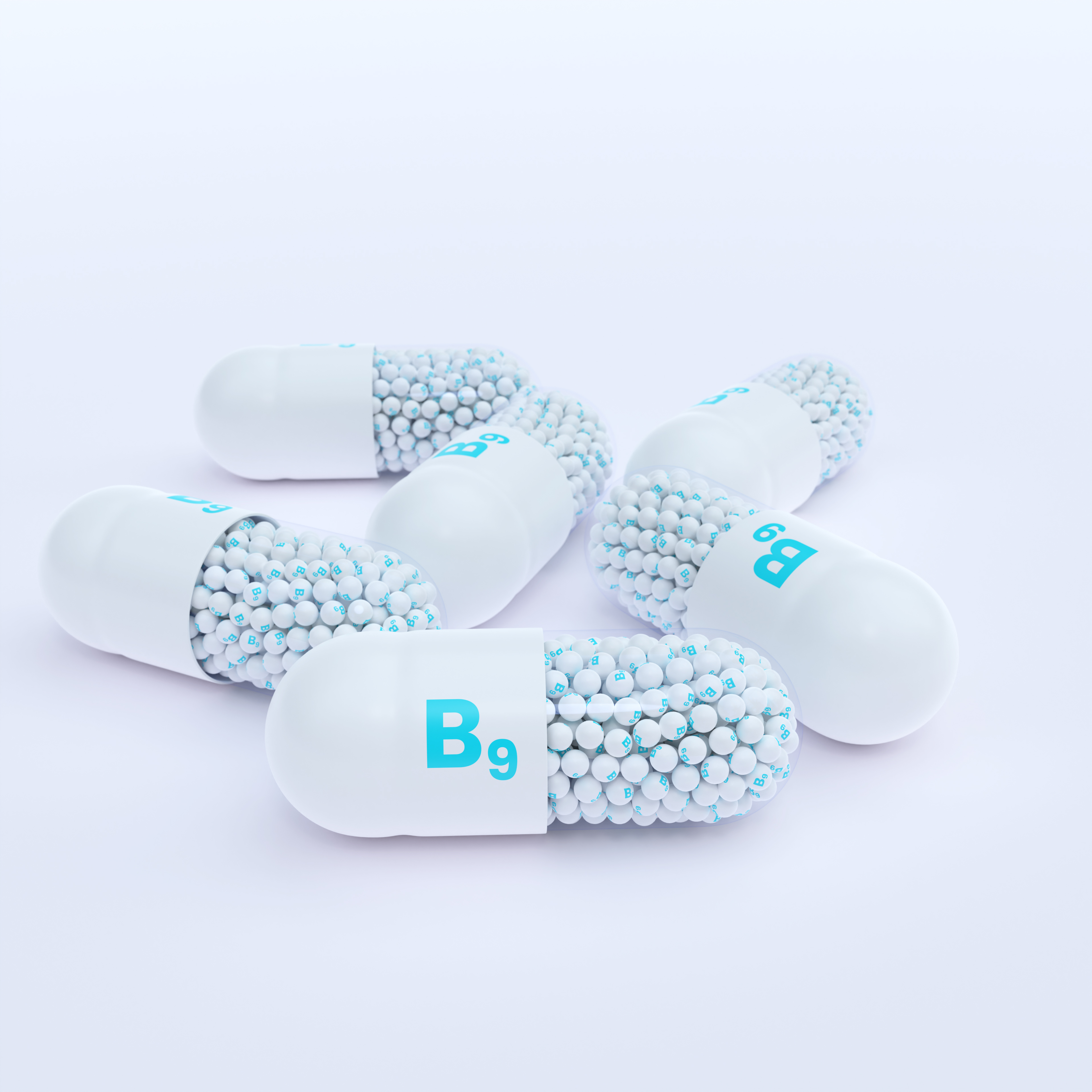 Vitamin B9 With White Capsules, Granules and White Background