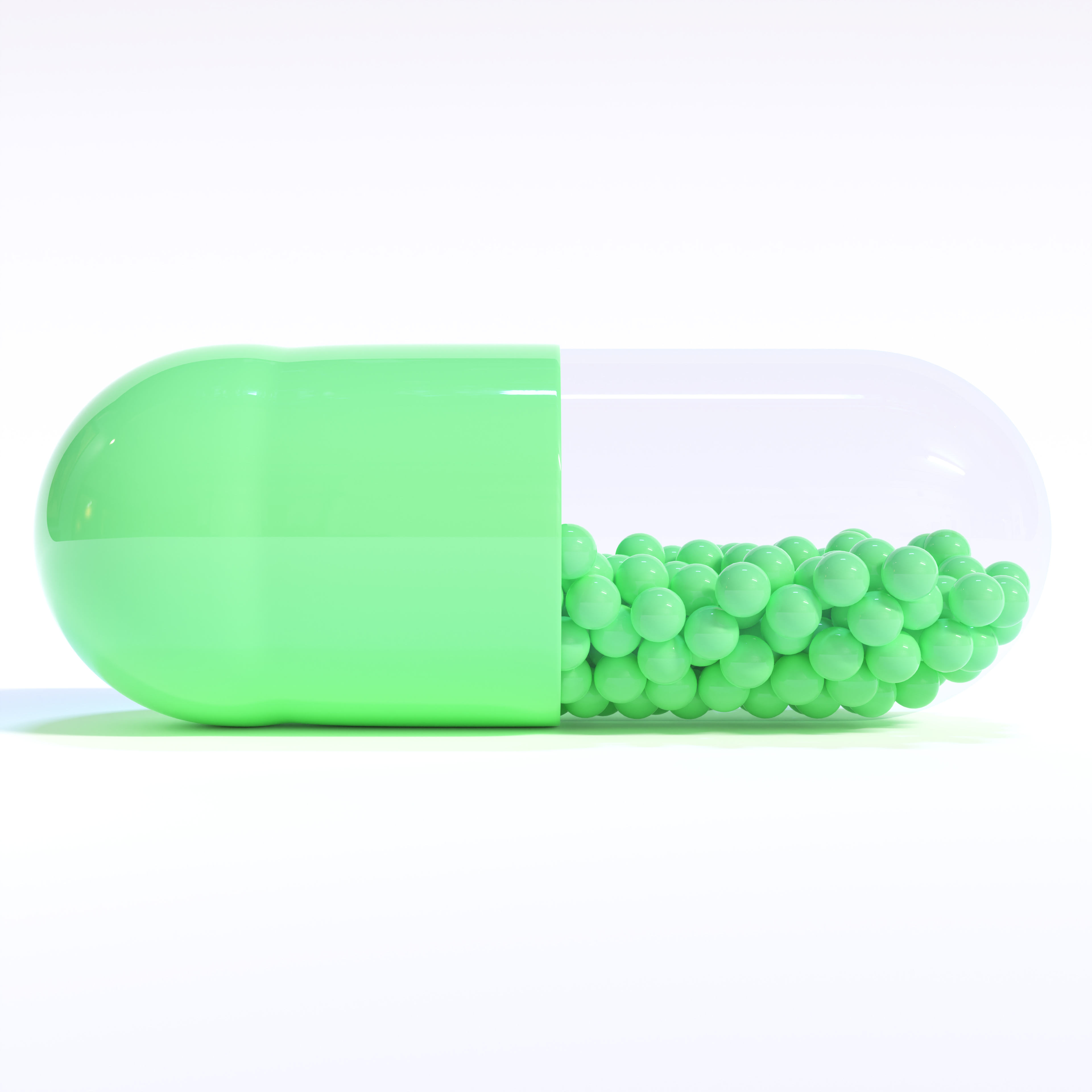 Green Capsule Full of Granules On White Background