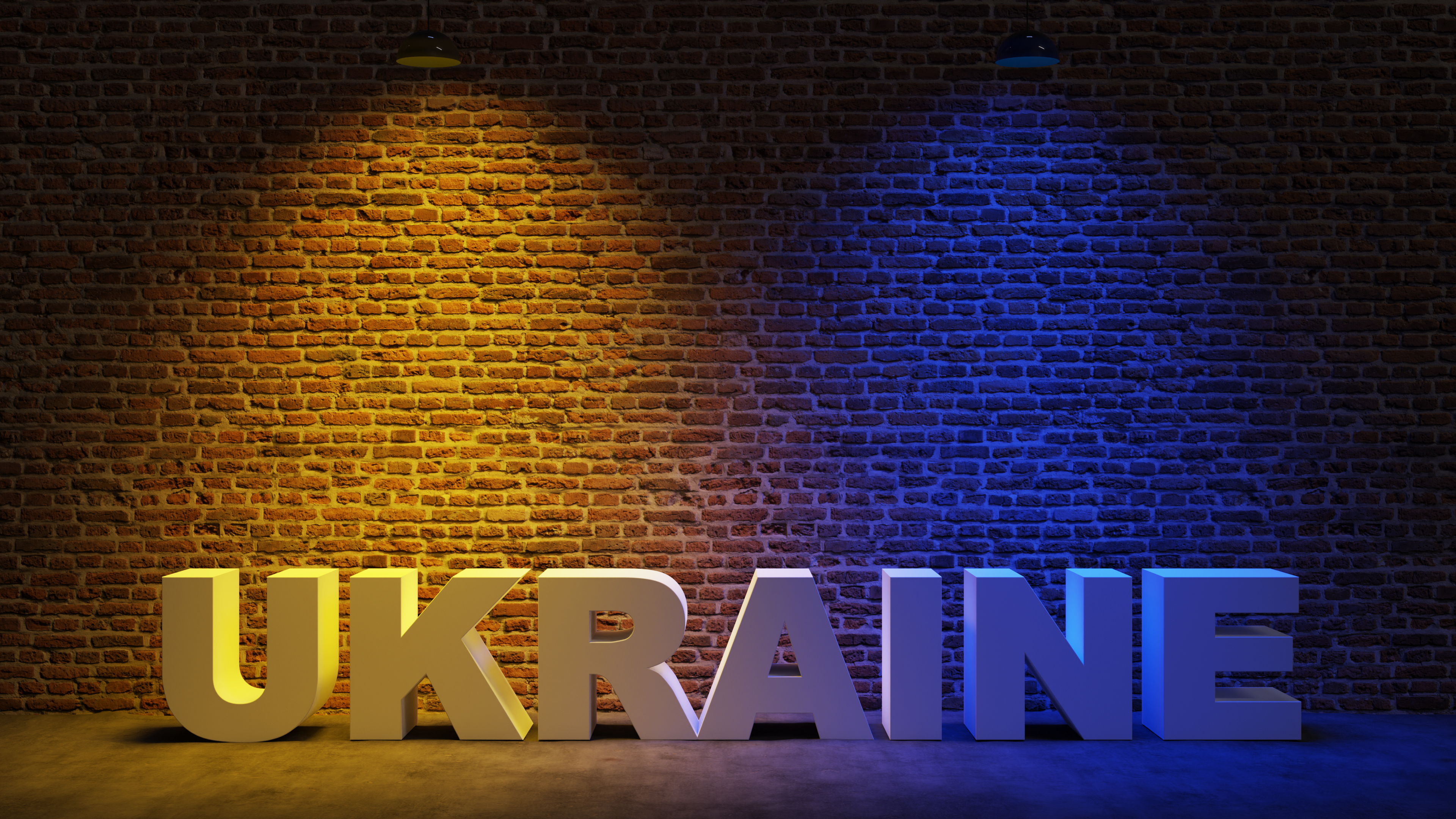 Brown brick wall background with spot lighting effect. Yellow, Blue. UKRAINE