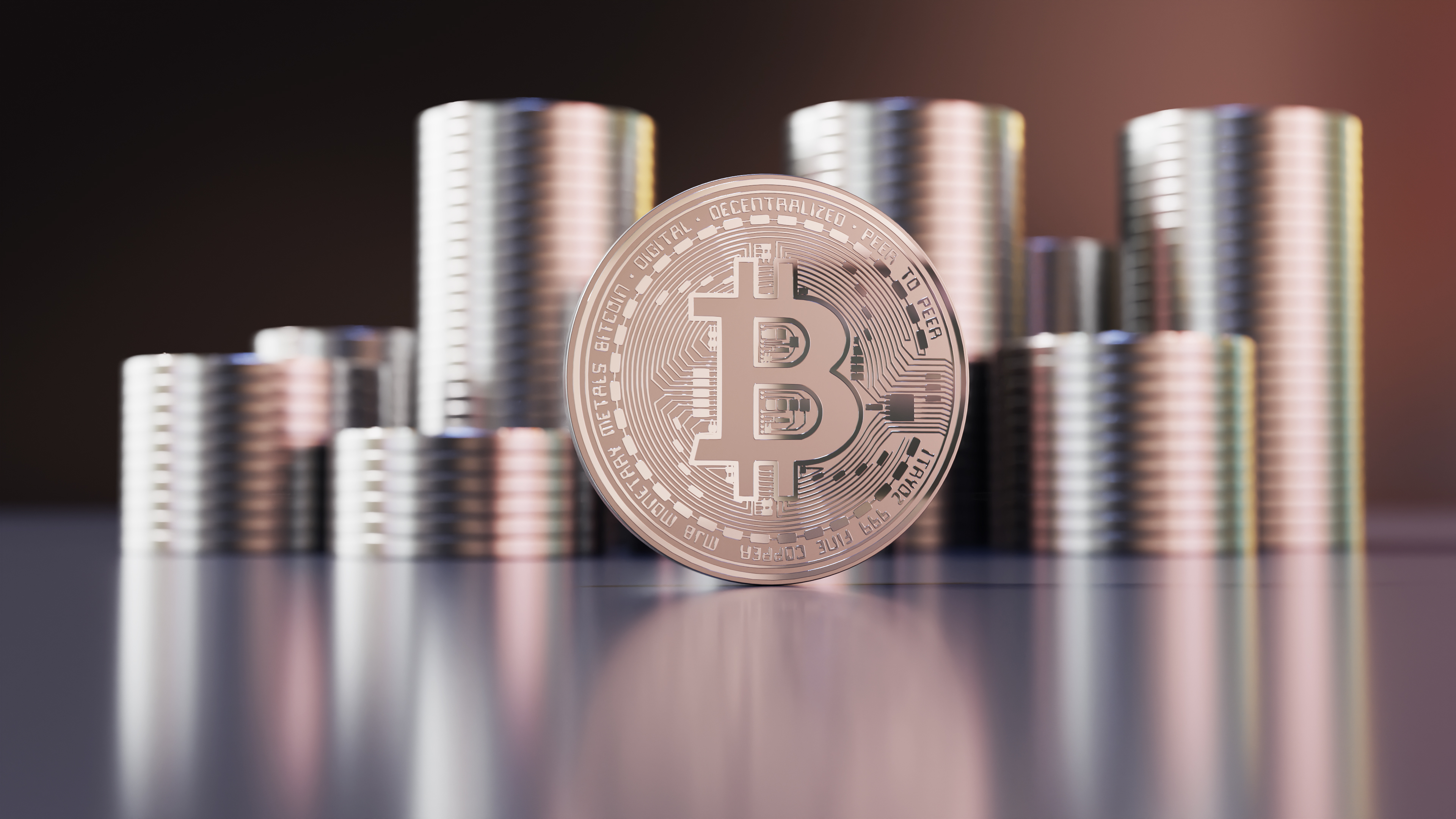 Silver Bitcoin With Coins In The Background