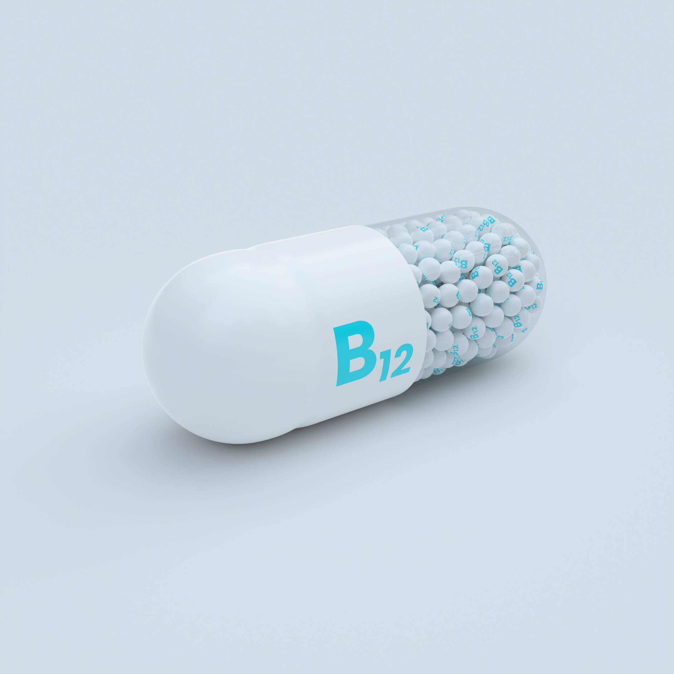 Vitamin B12 With White Capsules, Granules and White Background