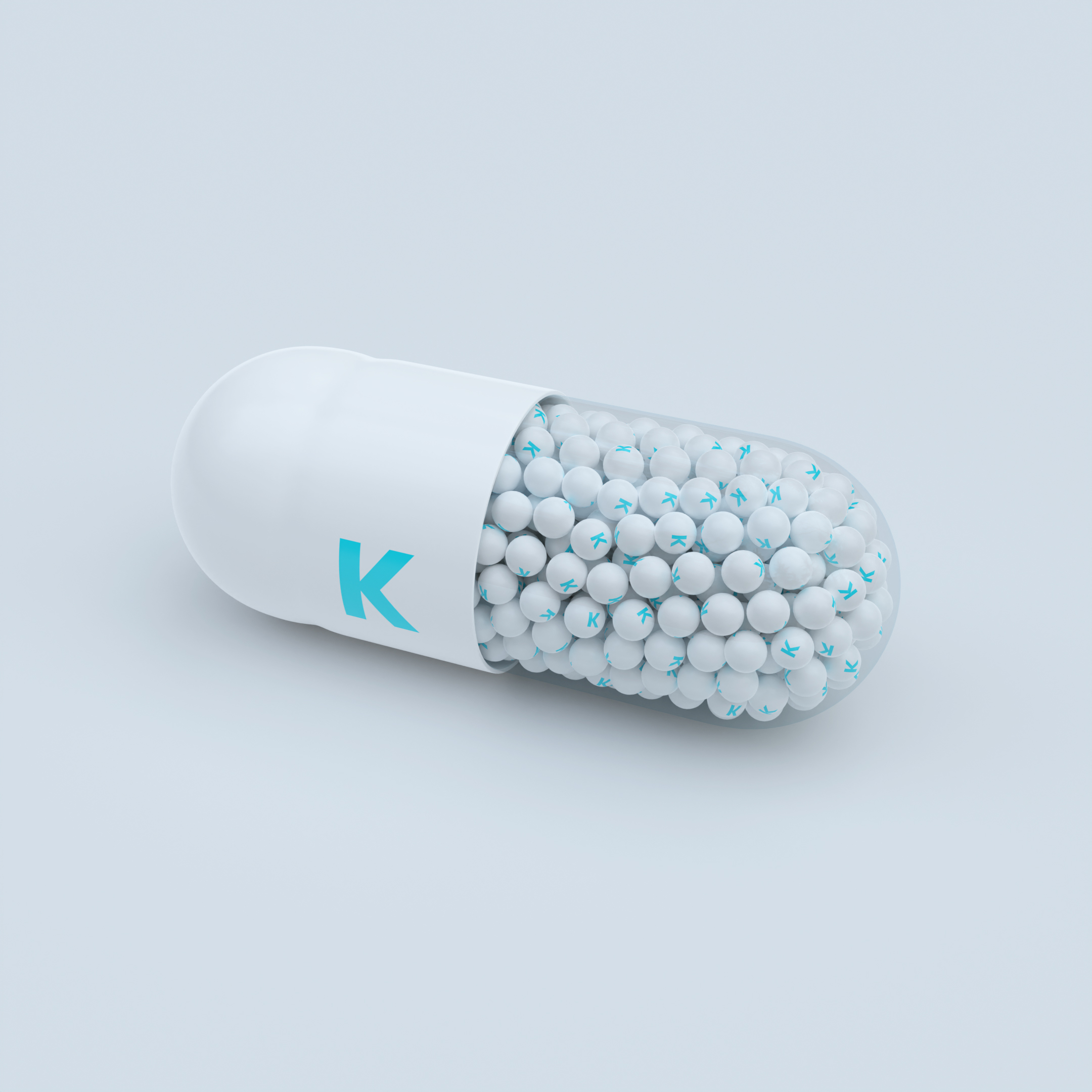Vitamin K With White Capsules, Granules and White Background