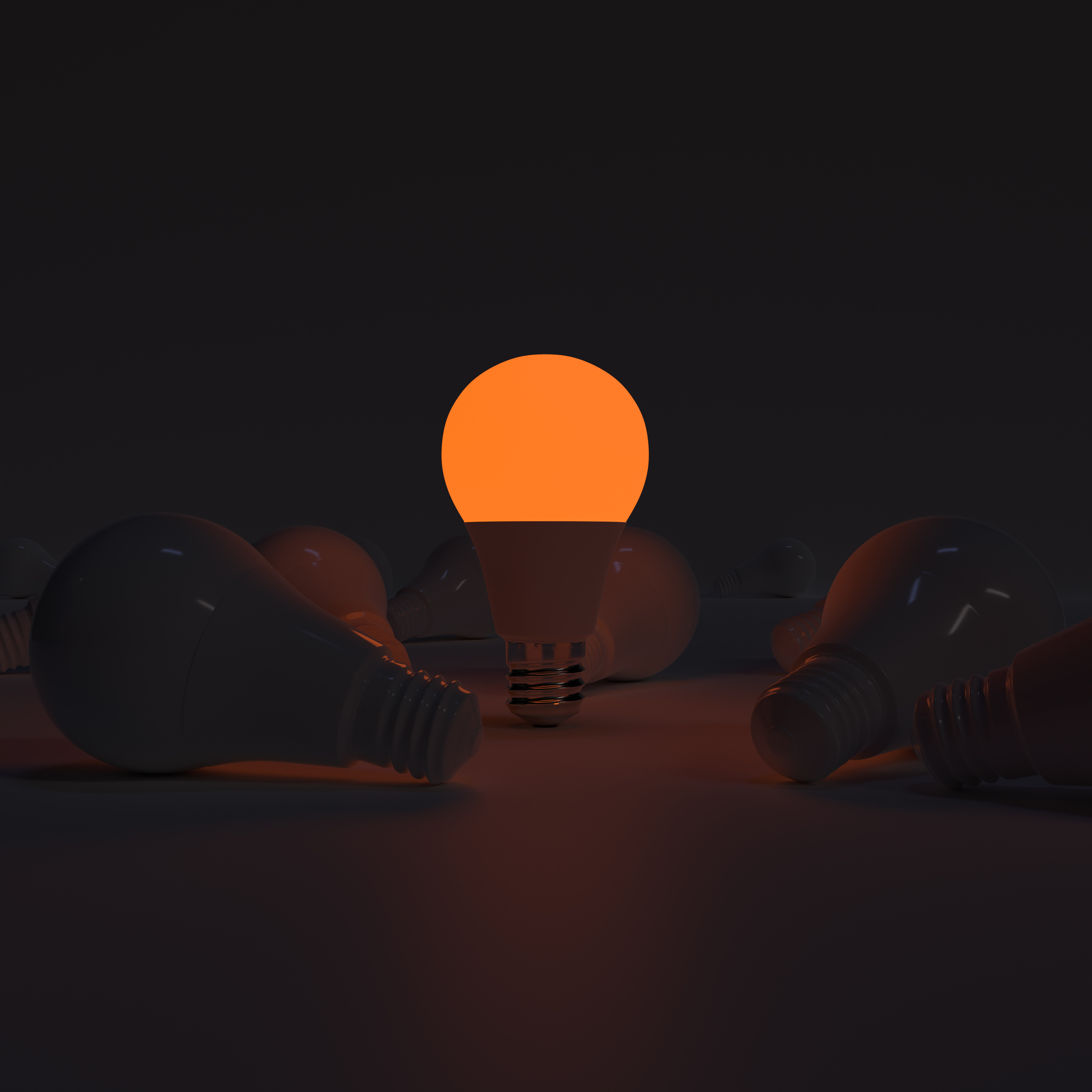 One of Lightbulb glowing among shutdown light bulb (Orange)