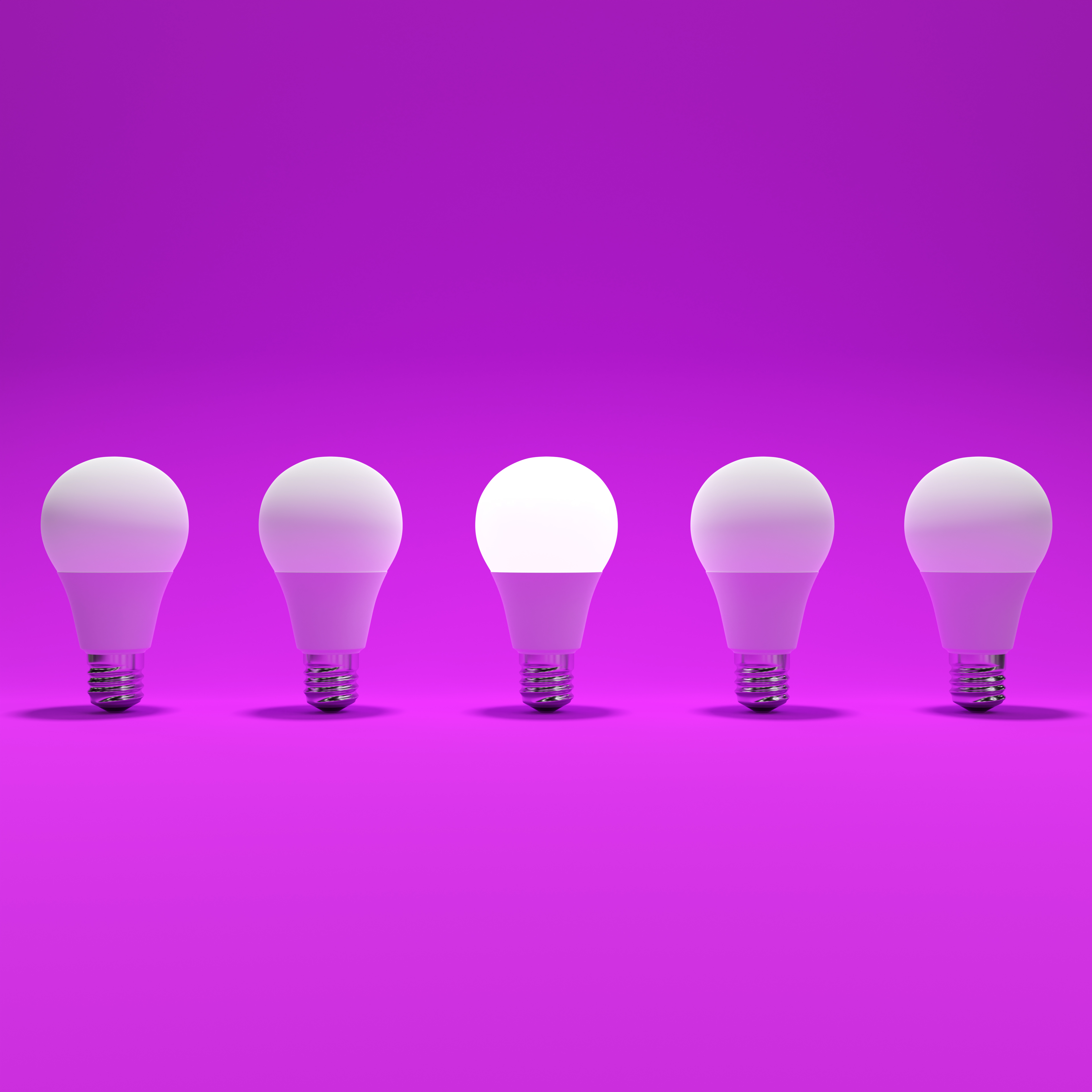 Five Lightbulb and One Glowing Lightbulb with Purple Background