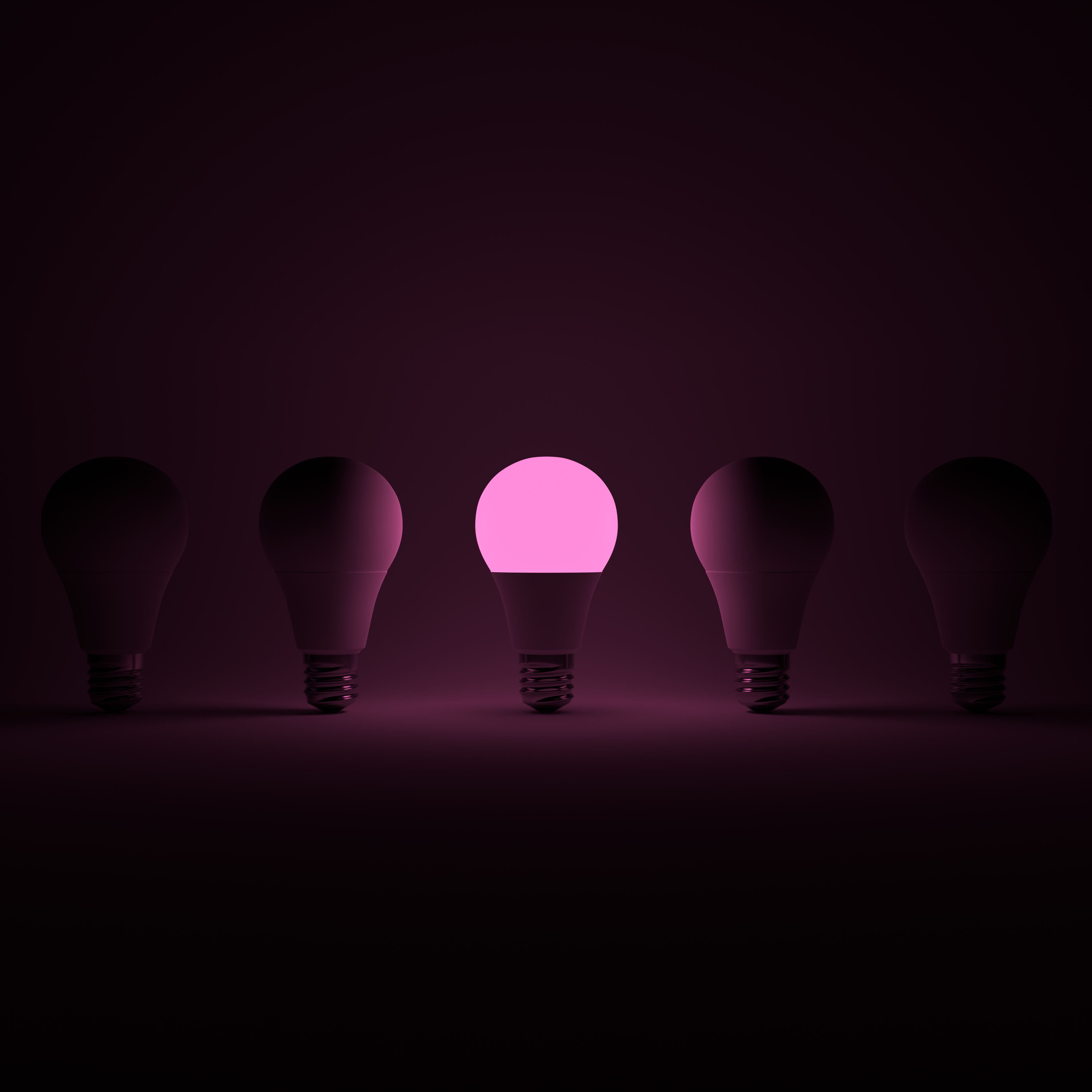 Five Lightbulb and One Glowing Pink Lightbulb with White Background