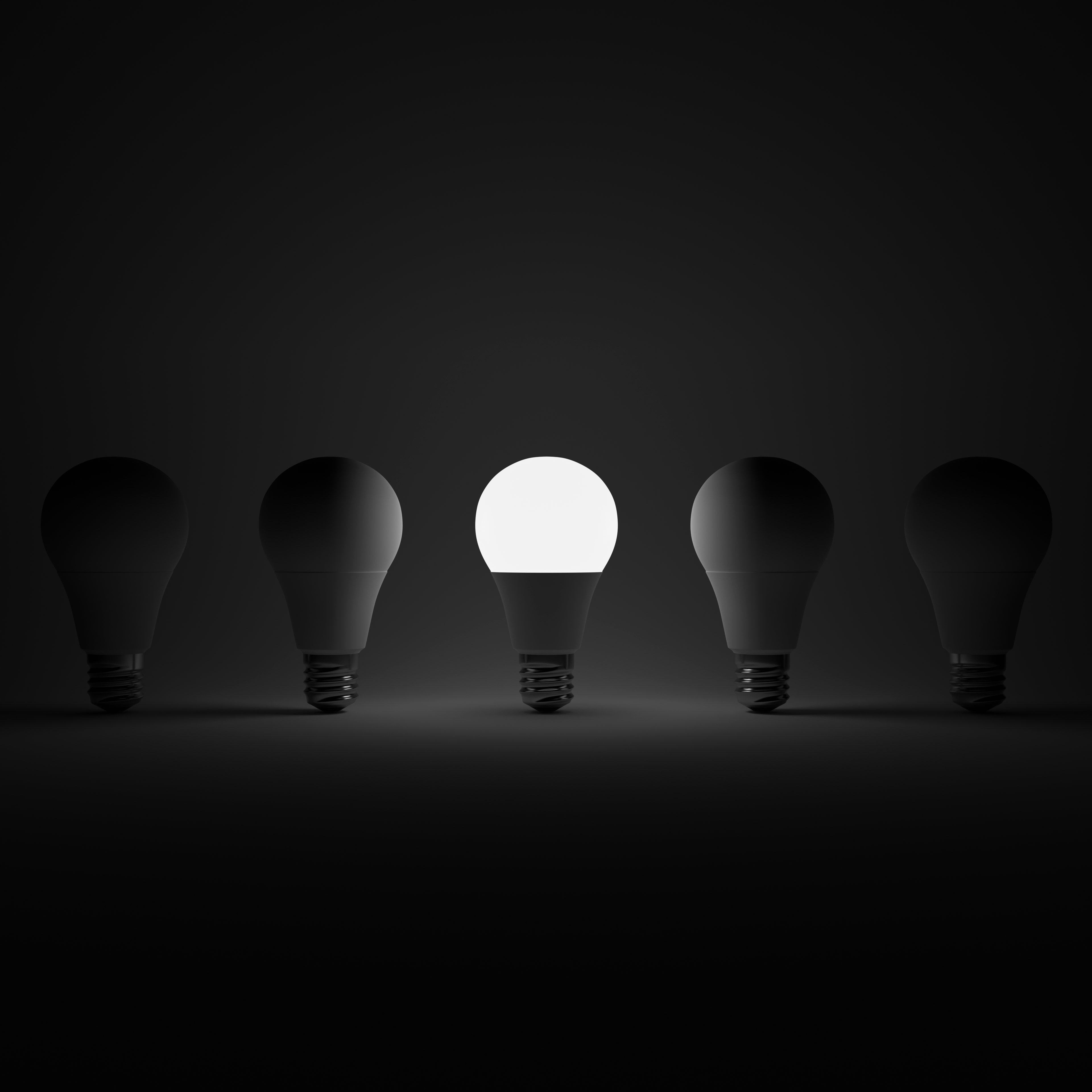 Five Lightbulb and One Glowing White Lightbulb with White Background