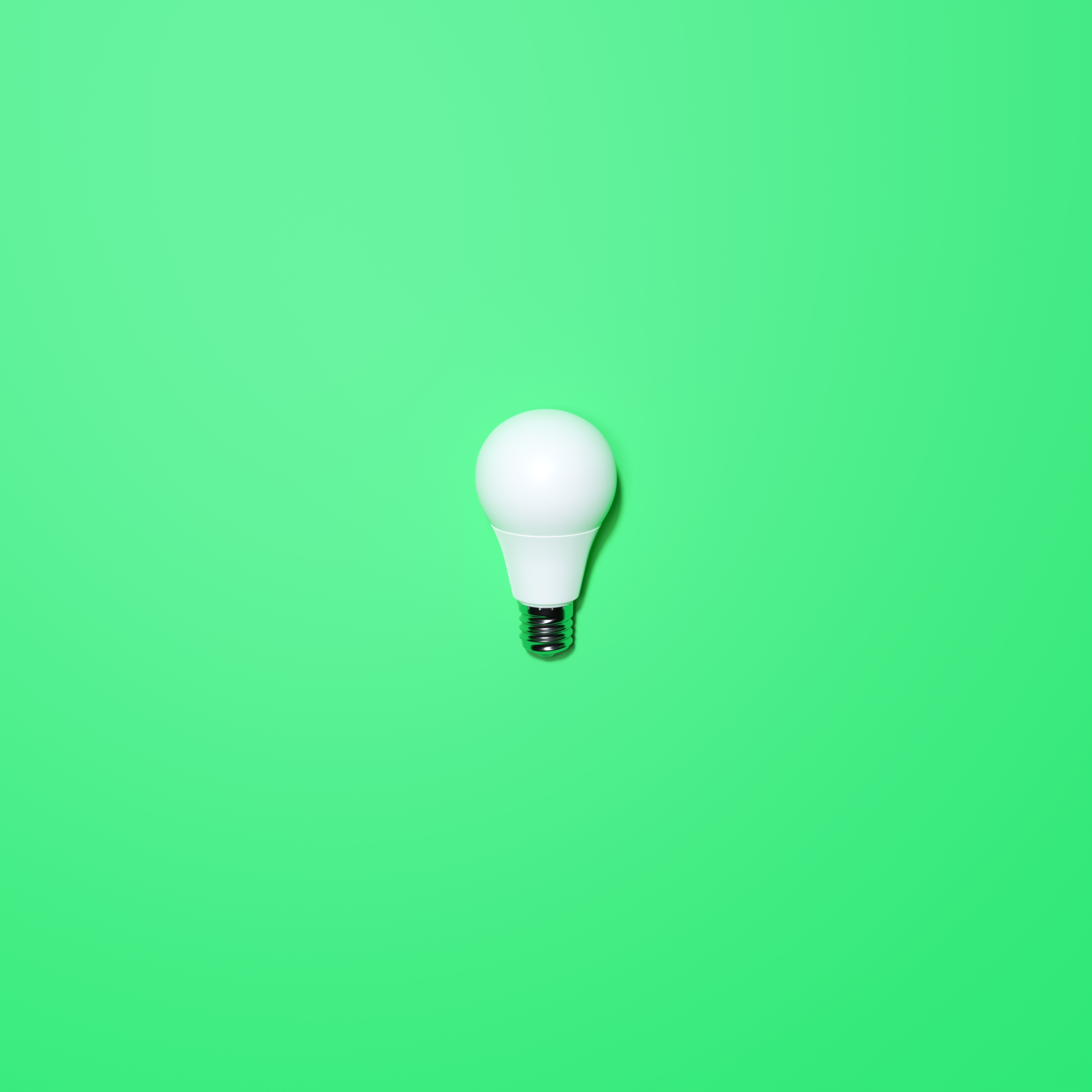 White Lightbulb With Green Background