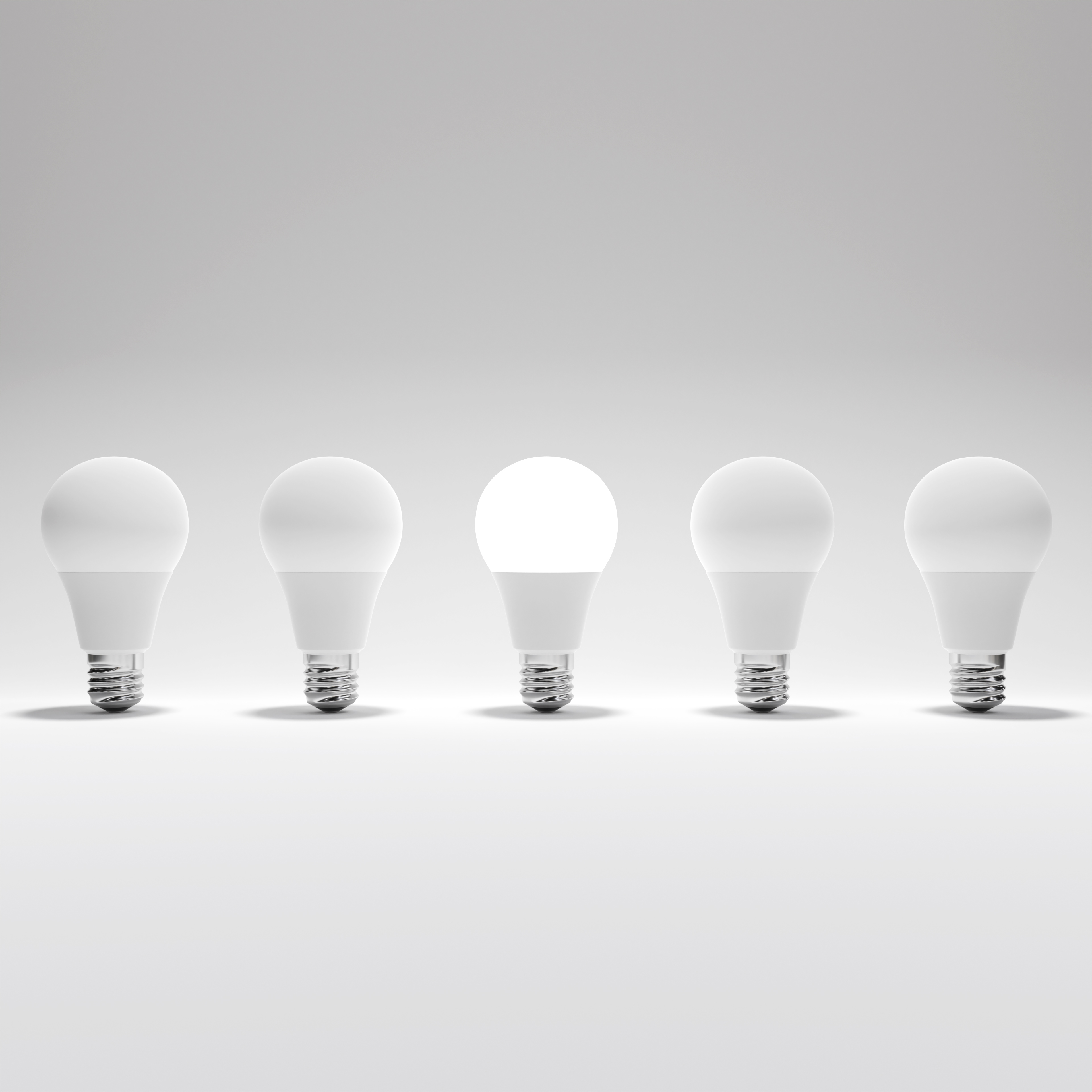 Five Lightbulb and One Glowing Lightbulb with White Background