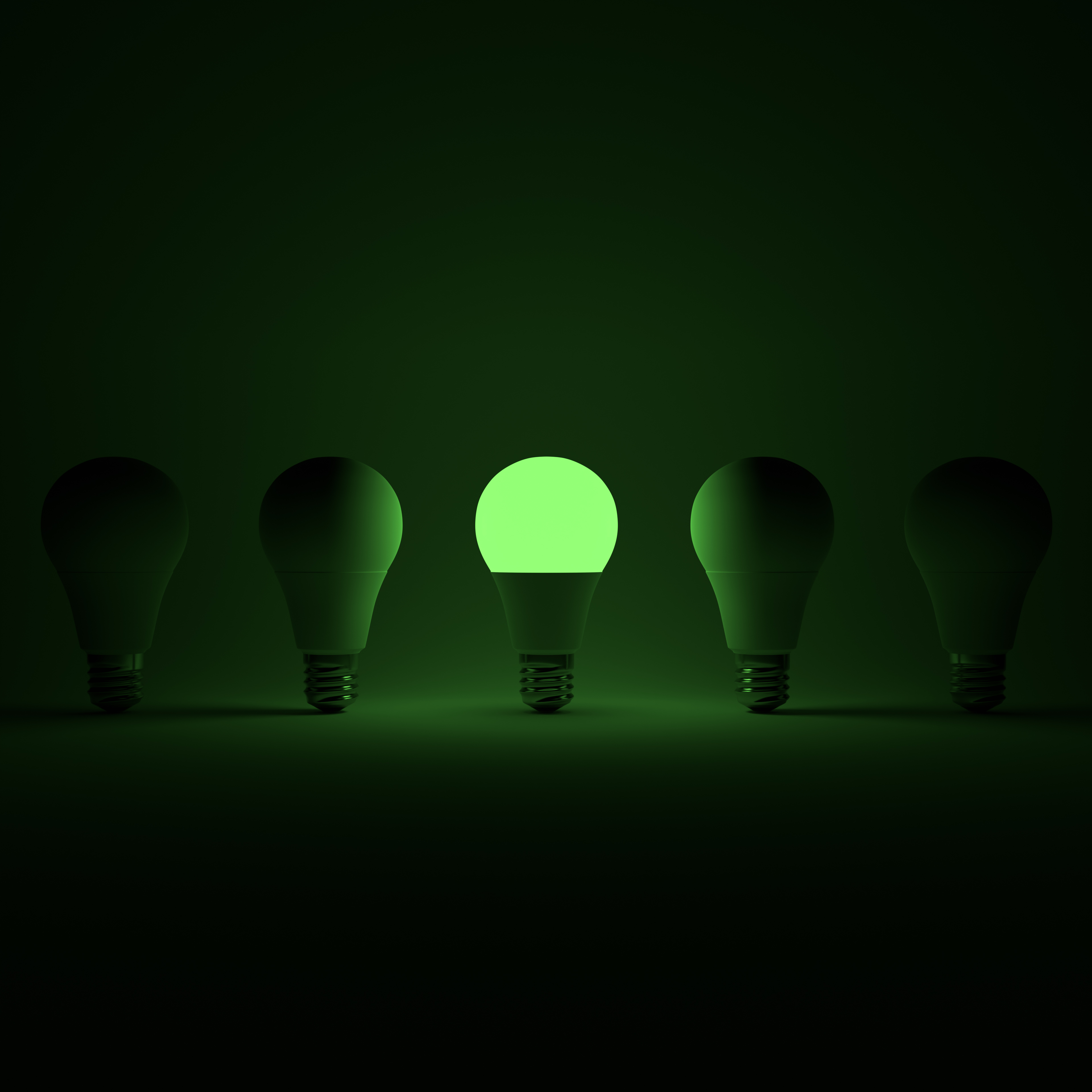 Five Lightbulb and One Glowing Green Lightbulb with White Background