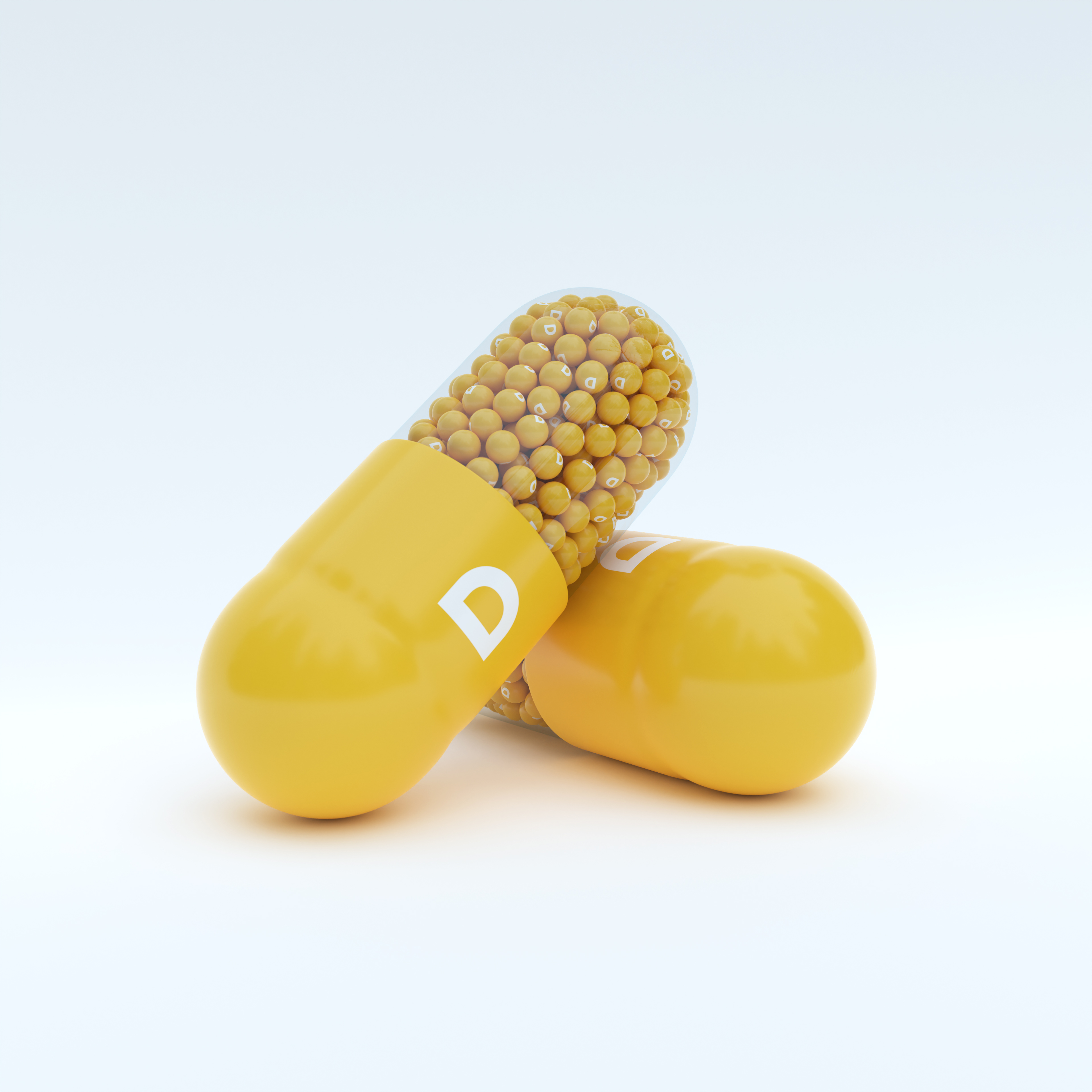 Vitamin D With Yellow Capsule, Granules and White Background