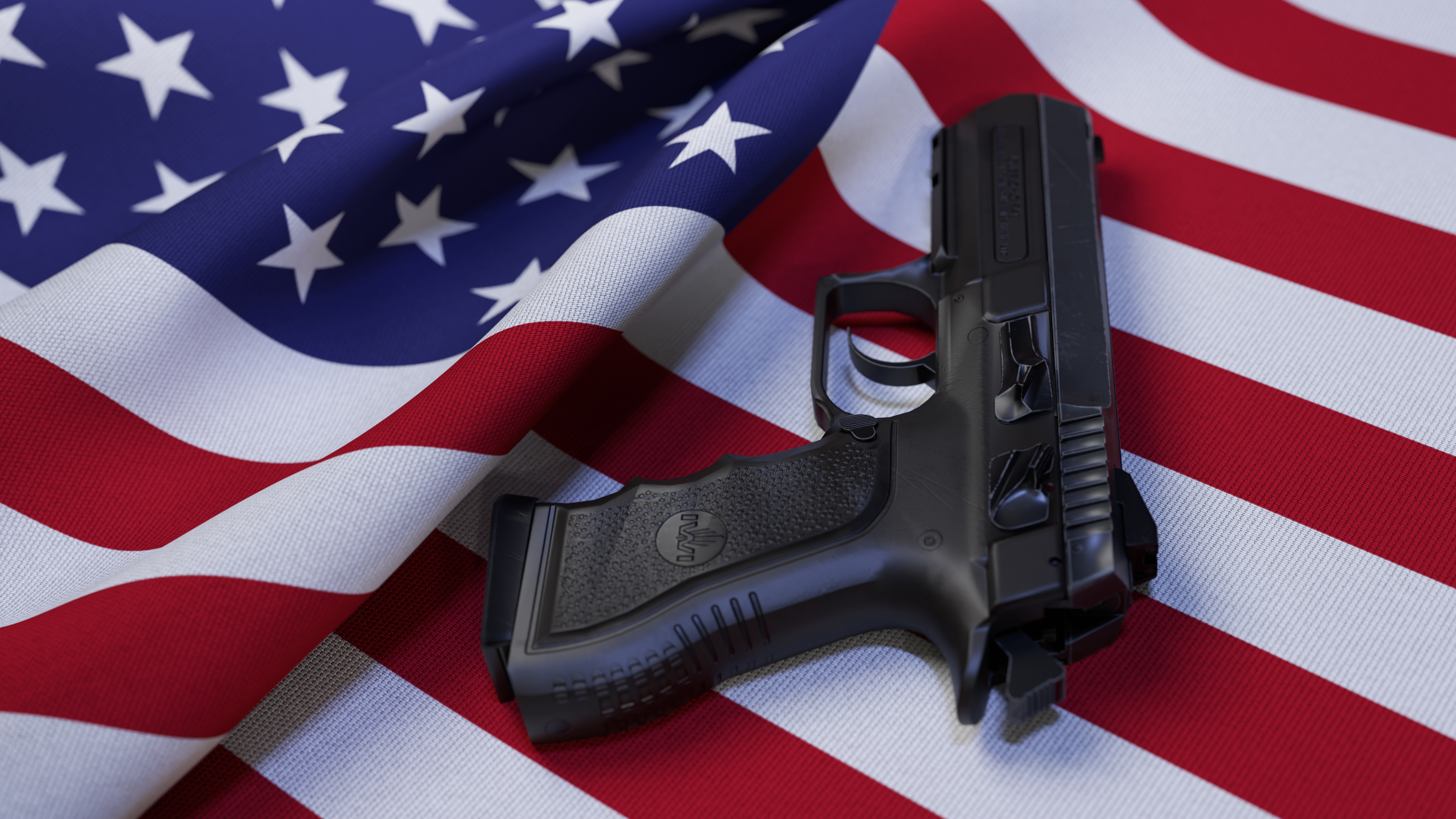 A black pistol on the flag of USA