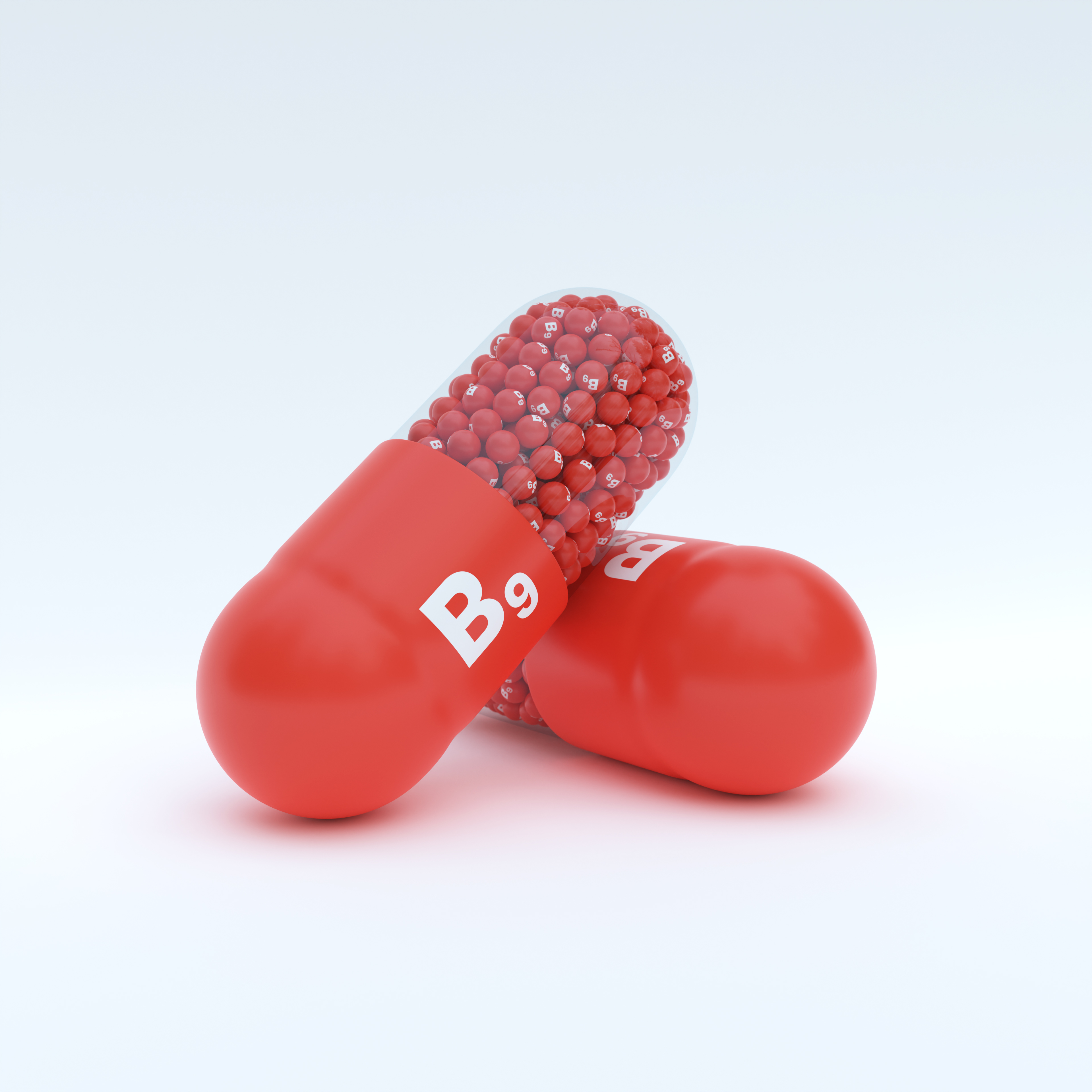 Vitamin B9 With Red Capsule, Granules and White Background