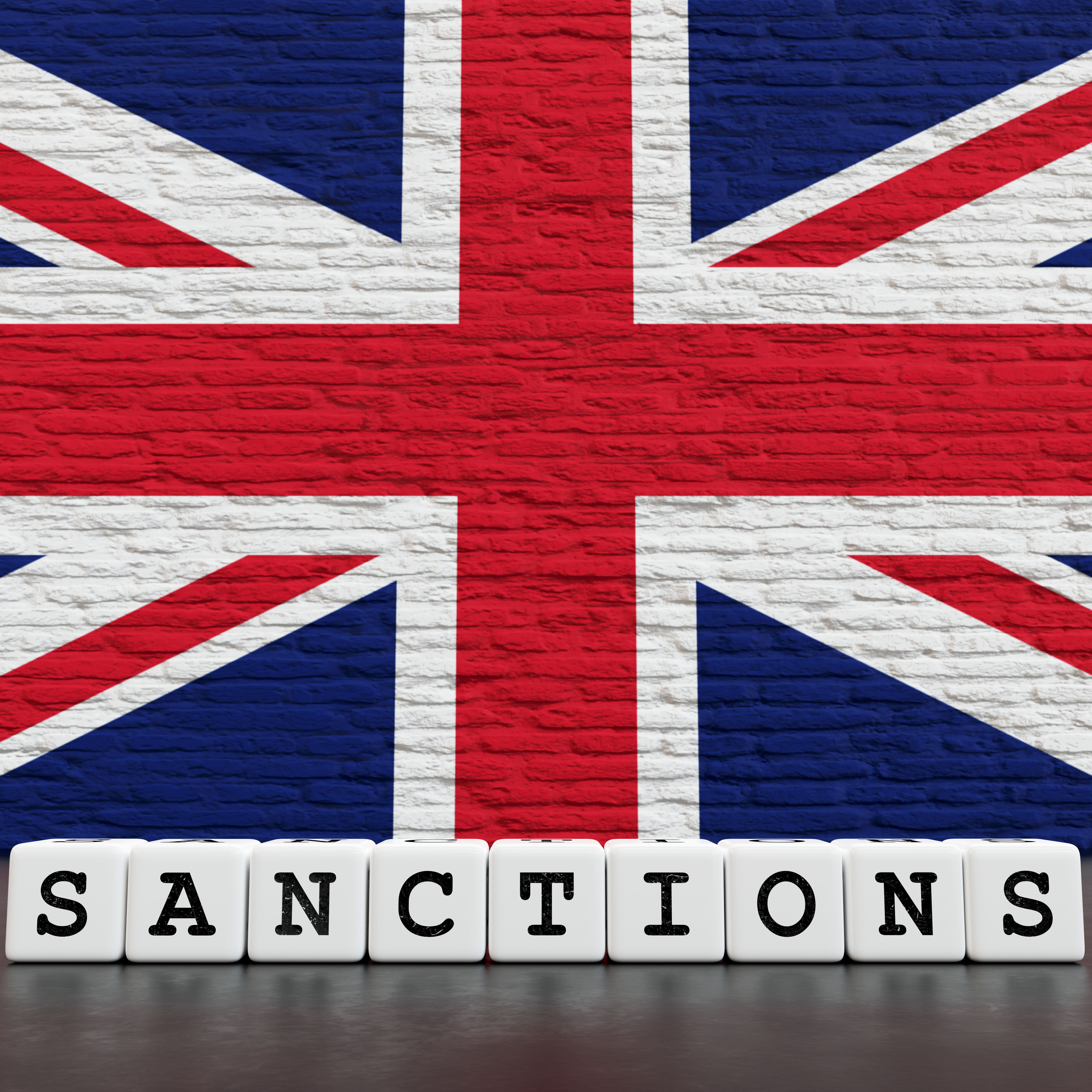 United-Kingdom Flag on Bricks Wall With Sanctions