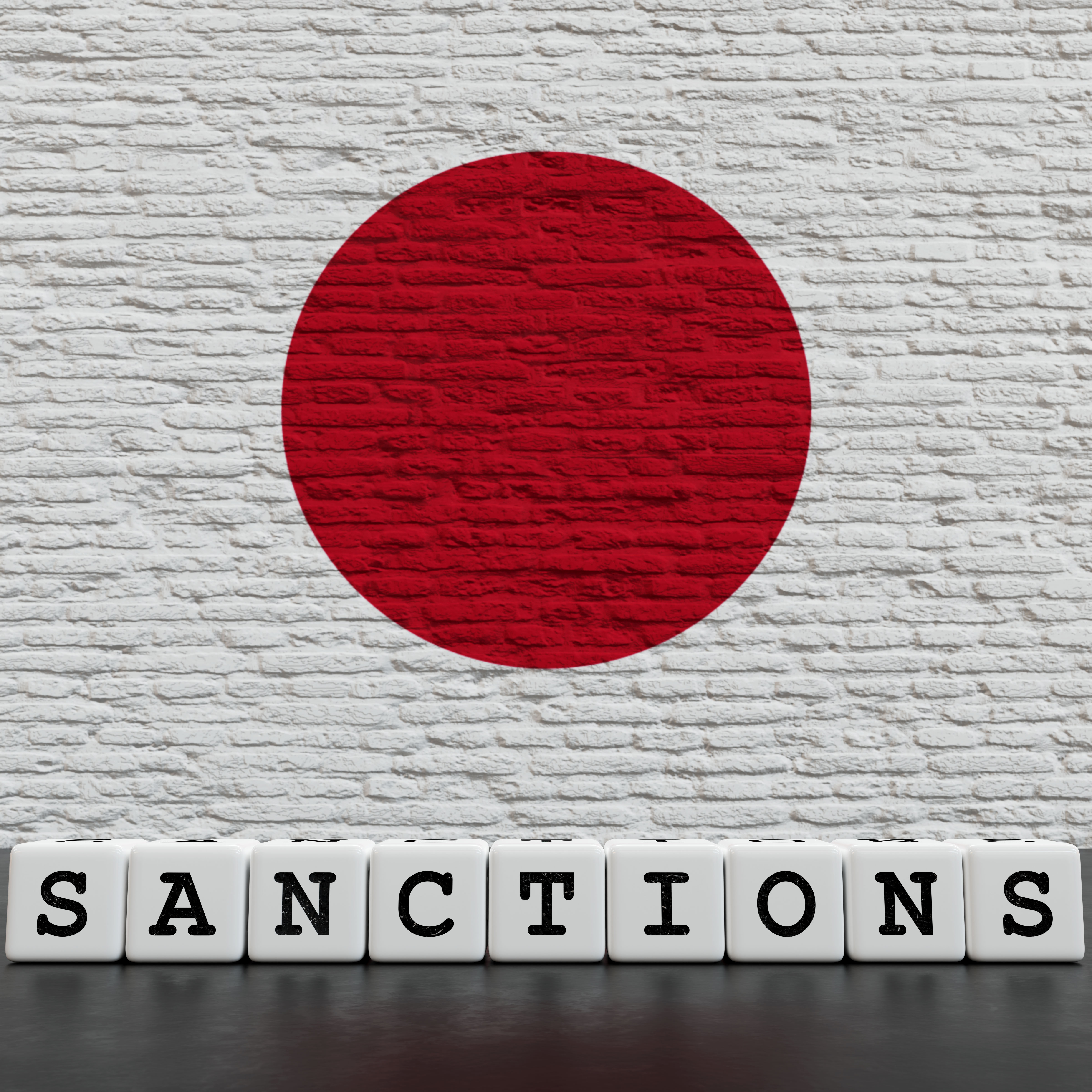Japan Flag on Bricks Wall With Sanctions